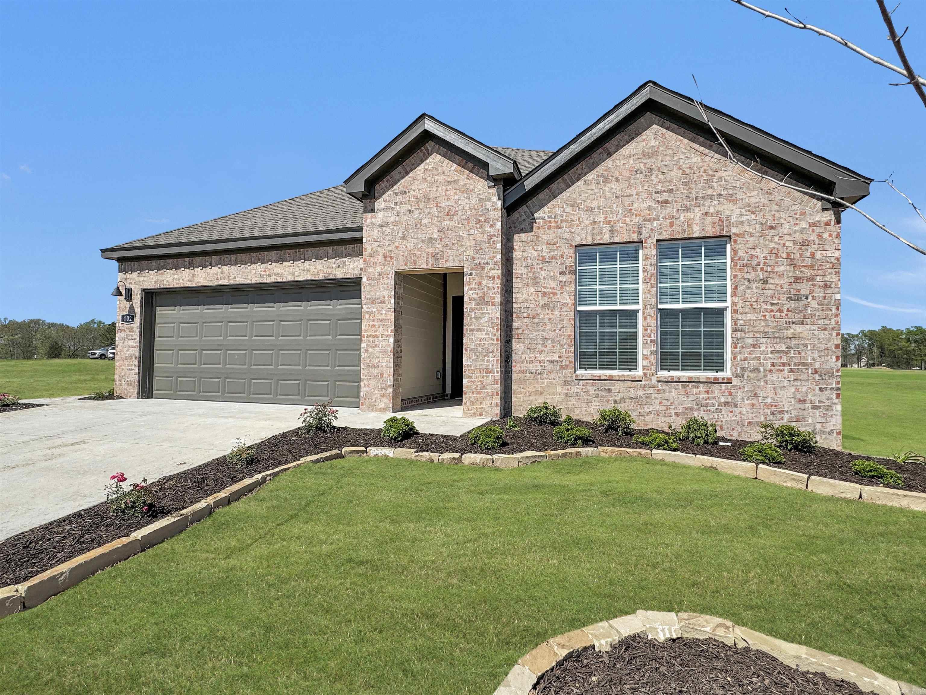 Charming Cali plan! Indulge in the ultimate living experience at The Reserve at Country Club. These meticulously crafted single-family homes are designed to offer unparalleled comfort, luxury, and convenience. Located on the serene southeast side of Maumelle, you will find yourself surrounded by breathtaking natural beauty, yet only minutes away from schools, world-class golf courses, and a plethora of dining options. Come and experience the lifestyle you've always dreamed of in a brand-new home in The Reserve at Country Club! These homes will be 4 sides brick! Living room will showcase a beautifully modern Electric Fireplace with heater. Exquisite quartz counters in the kitchen and bathrooms, beautiful kitchen backsplash, LVP flooring and carpet, 9 and 10’ ceilings and more! Tax amount TBD. HOA fees cover management and other. Estimated completion date is October, 2024.
