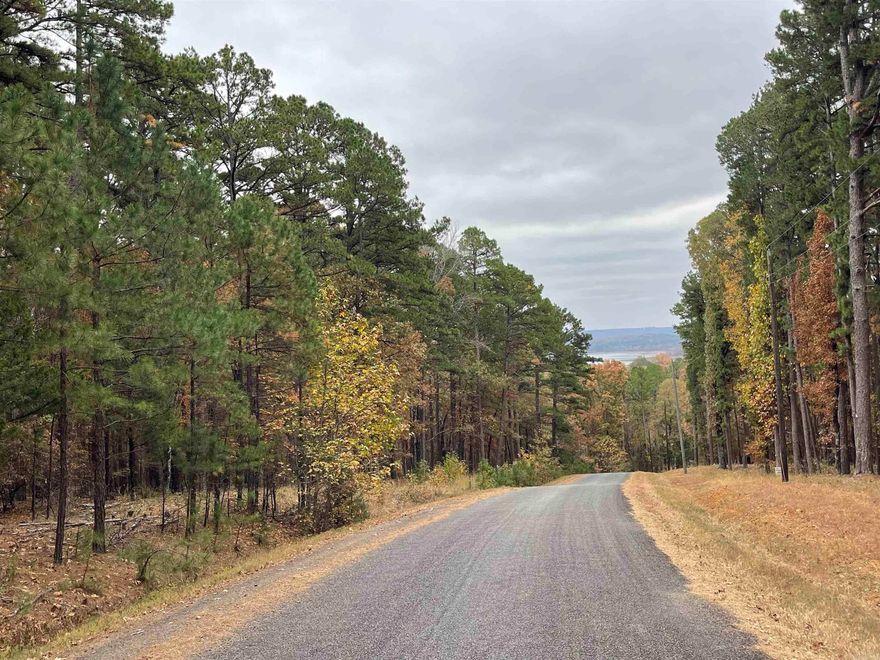 Wooded Lot less than a 1/2 mile to Circle Acres concrete Boat ramp with parking spaces at ramp for boat and trailers. ALSO,90+ miles of ATV trails up the road. Minimum of 1,200 sq.ft. to build. No mobiles allowed.The Cabins & Lakehouses in the area provide that lake feel people are looking for.Majority of the homes are weekenders in the area & a few full time as well.Only 7.6 miles to the town of Greers Ferry, only 3.4 miles to Indian Hills Golf Course, & FFB also has miles of Mountain Bike Trails .