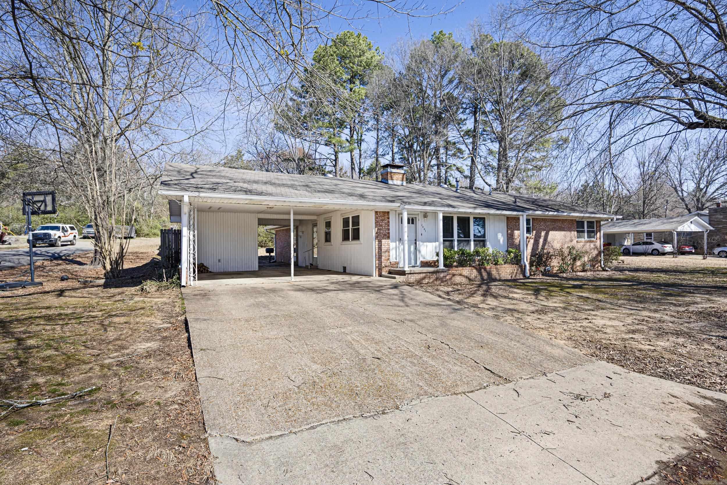 OH MY! NEW ROOF! NEW COOKTOP!! This home has plenty of things to talk about! There's the easy access to the Interstate for starters. The .65 acre lot INSIDE the city limits is another. This home has been well-cared for over the years. It has only had two owners in all these years. Original owner added a 420' square foot kitchen and converted the old kitchen into a multi-use room that is accessed off the carport. The kitchen has a huge island with solid surface counter tops with eating area, built-in office space, pantry and dining area big enough to seat 8 at the table. There is LTV flooring in the kitchen and beautiful original wood floors in most of the house. There is natural gas to the dryer, water heater (2019), furnace (2012) Other updates made by seller include gutters (2023), new windows (2016), LTV flooring in kitchen and blinds ($1500). In the over-sized back yard, there is a nice size patio area and 3 storage buildings. The residents of Fleetwood Addition have the use of the community park for birthdays, family reunions and play time. Come feel the love!