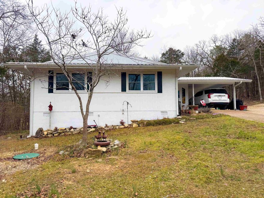 Welcome to 9 Pagosa Drive in Cherokee Village — a centrally located home that feels worlds away. Tucked down a quiet, lightly traveled street near the town center, this property offers rare seclusion without sacrificing convenience. This 3-bed, 1.5-bath home has been thoughtfully updated throughout, allowing you to simply turn the key and settle in. Even the furnishings are negotiable, making the transition effortless. Major improvements bring true peace of mind, including a newer metal roof, new septic system, new double-paned, double-hung vinyl windows, new water heater, and fresh exterior paint. Inside, comfort takes center stage with a remodeled kitchen, updated bathrooms, and a bright Arkansas room equipped with a mini-split for year-round enjoyment. Situated on two lots, the property also features a 12×20 Bald Eagle Barn with electricity, perfect for storage, hobbies, or a workshop. With its blend of privacy, location, and turnkey updates, 9 Pagosa Drive is an exceptional opportunity in the heart of Cherokee Village.