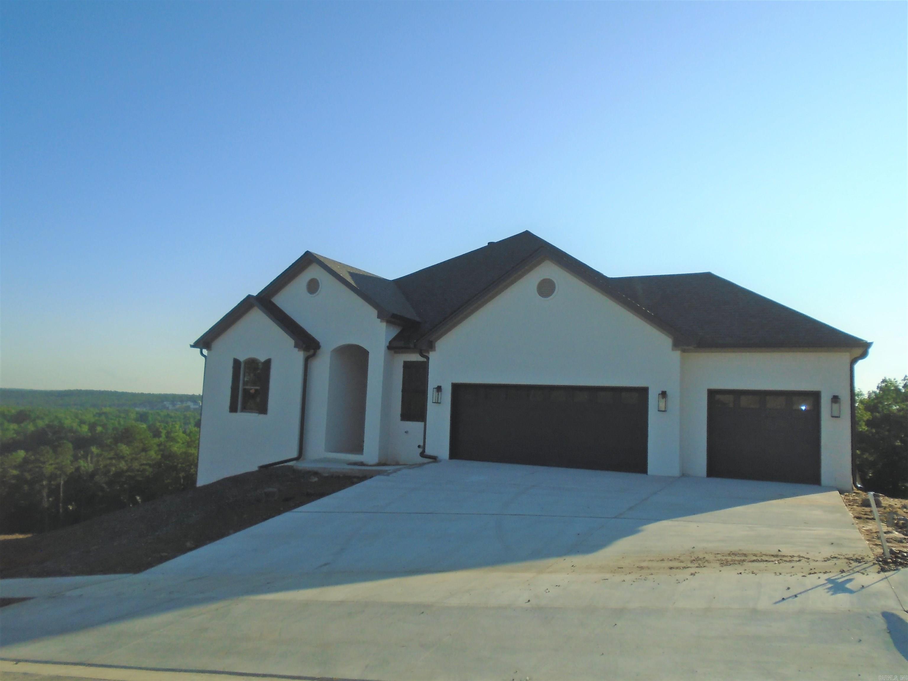 Beautiful luxury home in the newest addition of Maumelle Valley Estates! This home offers you 6-Bedrooms, 4-Bathrooms and 2-Living areas! Split to the rear style home that has a deck on each level and top deck has a view, greenspace & fireplace that is perfect for entertaining! Relax with privacy & nature at your new home. The open floor plan allows for effortless flow between living room, dining area and kitchen, which makes it ideal for entertaining guest or enjoying time with family. Quartz Countertop, Large Island, built in trash can bend, pull out drawers and Gas Cooktop range. Primary bedroom has trey ceiling and NO carpet, plus spa like bathroom with a soaking tub, separate vanities with plenty of storage, his & hers own walk-in closets and built-in chest. Upper living space is done with the Luxury Vinyl Plank Flooring (LVP). Lower level has 4-BD & 2-BA and bedrooms are separated, Carpet in the bedrooms and LVP in the living/bonus area. Large Laundry Room with sink and extra space for another fridge or freezer, plus Tankless W/H, Energy Efficient HVAC, Plenty of natural lighting! Call for a showing today! Completion date by July 31,2023.