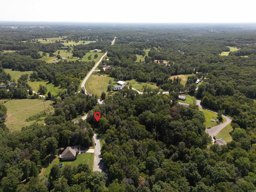 Your dream canvas awaits on Amber Lane, Bella Vista - a flat and rare 0.35-acre corner lot. Design your ideal home on this spacious and level property nestled in the heart of Bella Vista, surrounded by the Ozark Mountains' natural beauty.