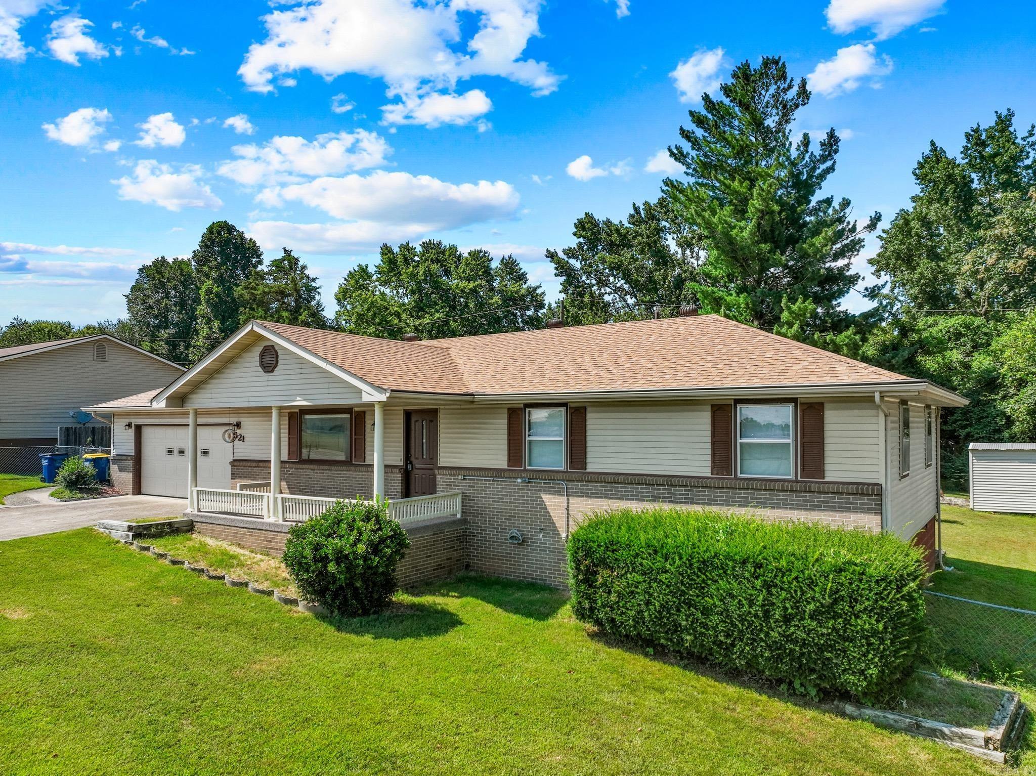 This one checks all the boxes! Tucked into a great in-town spot near schools and the hospital, 521 E 13th Street offers 3 bedrooms, 2 bathrooms, and a bright, welcoming vibe across 1,274 square feet. You’ll love the updated kitchen and bathrooms, fresh carpet in the bedrooms (2025), new roof (2024), and HVAC (2023)—the big stuff is already done. The sunroom adds flexible space for work or play, and the oversized 2-car garage plus wide driveway means storage and parking are no problem. Out back, a fully fenced yard and a huge deck make it the perfect place to relax, entertain, or soak up the sun. With a great layout, major updates, and a backyard built for memories, this one feels like home! Seller is offering a free 14 month home warranty through Home Warranty Inc. - Core.