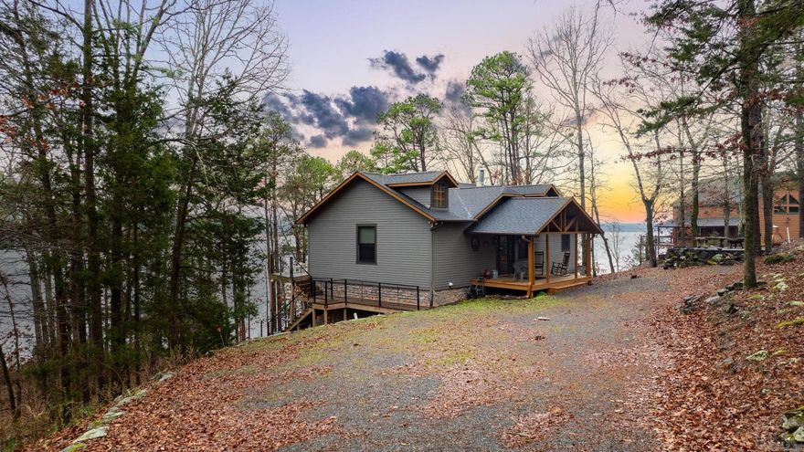 This is the kind of lake-front property you don’t want to miss—close to the water, lake views, spacious, and truly turn-key. This property adjoins the Corps of Engineers white line and offers an easy walk toward the water, with a few stone steps leading into a clear 6-foot path permit (new owner to re-apply through the Corps of Engineers). The home is approximately 2,316 square feet and features 3 bedrooms, 2 bathrooms and a bunk area located directly across from Choctaw Marina. Inside, you’ll find a large living room with an eat-in dining area, pantry, and additional storage. The layout offers plenty of room for gathering or relaxing. The main level includes one bedroom and the primary living areas. The lower level features 2 bedrooms, a game room, bonus bunk area, full bathroom, and a laundry room with a utility sink. The larger expense items have already been completed, including a 2021 roof, June 2022 HVAC system, and new steel deck railing in 2023 and Pella windows. Additional updates include LVP flooring and interior and exterior paint.  No restrictions found (other than Corp of Engineers). Schedule a private showing today!