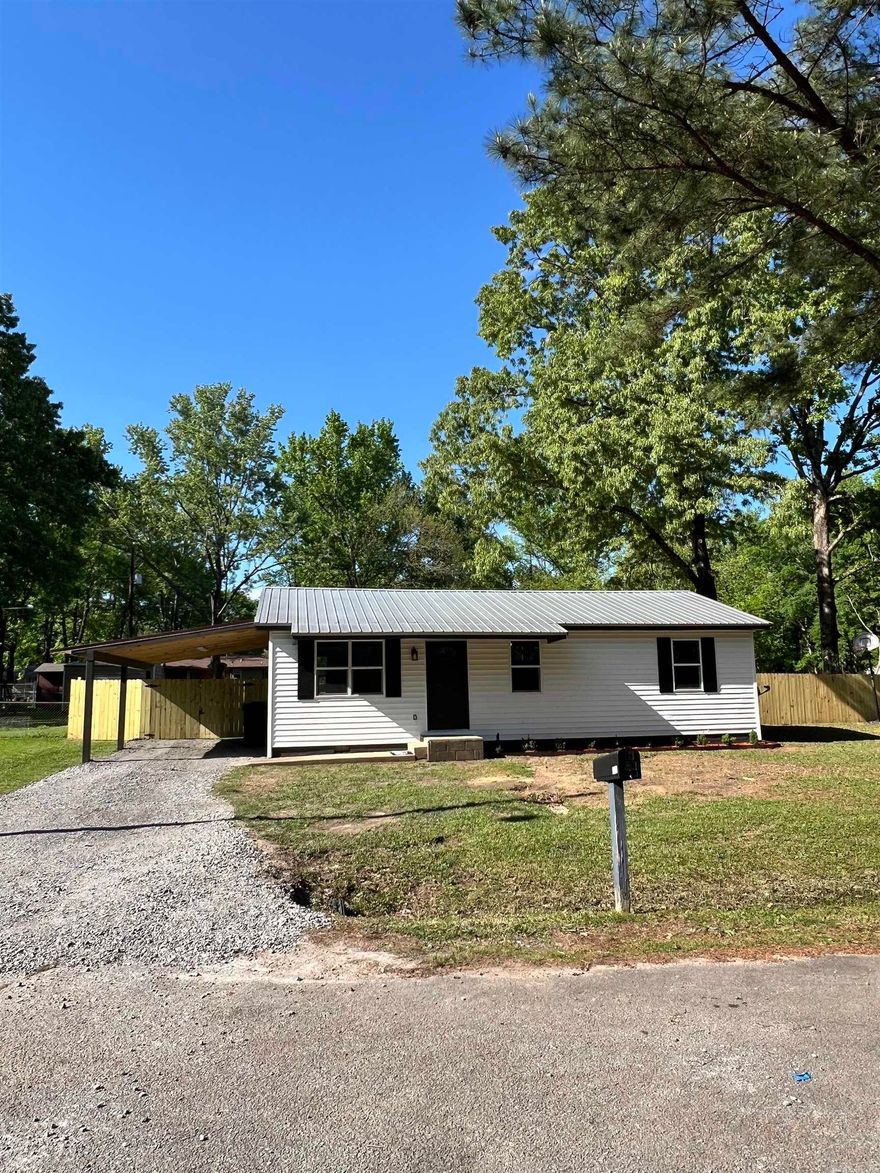 Conveniently located home has been completely remodeled with new siding, sheetrock, insulation, plumbing, electric, H&A, cabinets, appliances, flooring, fixtures etc.  Fenced yard with storm cellar and storage building.