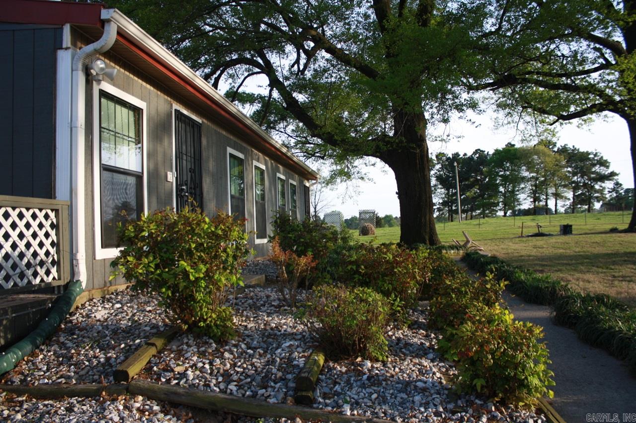 This gorgeous farm offers over 3,000 Sq. Ft. of living space. Home features 4 bedrooms,3.5 baths including approx. 1,300 sq. ft. finished basement. Central AC/Heat and electric fireplace. Metal roofing and wood wrap-around with panoramic views. Electric to property is backed up by a diesel generator. Farm has 4 (40x400) poultry houses (retrofitted) each holds 19,00 birds. Property also has a 30x60 and smaller outbuildings. Property has 3 spaces that is set up with utilities and septic systems for mobile home or RVs.    Data presented here is believed to be accurate, lot dimensions, age of home, square footage, and other facts have been obtained from the owners, appraisals or courthouse records and may not be accurate. All parties are strongly urged to independently verify all information.  Measurement is for the purpose of MARKETING, may not be exact and is NOT for loan, valuation or other purpose. IF EXACT SQUARE FOOTAGE IS A CONCERN, THE PROPERTY SHOULD BE INDEPENDENTLY MEASURED.