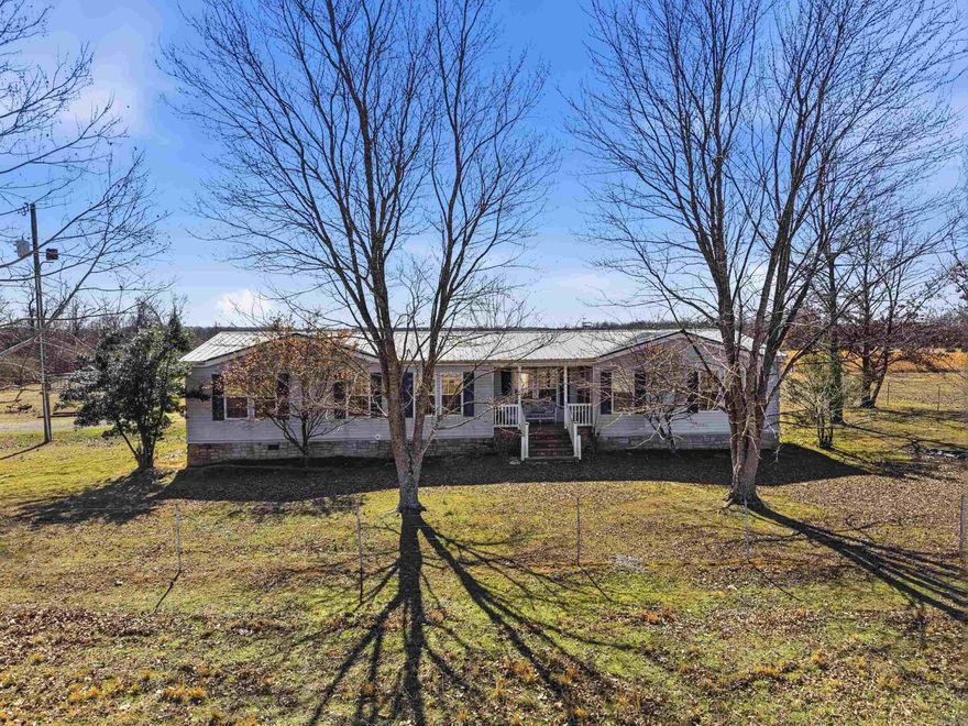 Enjoy peaceful country living on 10 acres with a barn! This well maintained home offers space and function for daily life. The open living and dining area features a fireplace and flows into a kitchen with abundant cabinet storage and workspace. The primary suite includes a walk in closet and a spacious bath with double sinks, separate shower, and soaking tub. Step outside to wide open views and usable land suited for animals, hobbies, and more. The large barn adds flexibility for agricultural or recreational use. A storm shelter adds peace of mind during severe weather. If you are searching for rural property, acreage, or a country home with land, this property delivers privacy and convenience, this is your dream home!  Schedule a tour today.