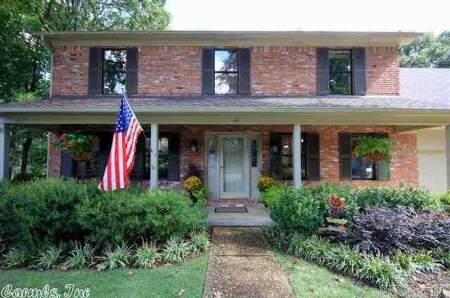 Great Looking Traditional in West Little Rock. Covered Front Porch Complete with Swing overlooks Landscaped Yard. Great Room with Hardwoods & Wood-burning Fireplace opens to screened-in porch.  Remodeled Kitchen has Bay Window, Granite Tiled Countertops, Backsplash & Solid Wood Cabinets. Four Bedrooms upstairs with Bonus Room.  Master Bath remodeled with walk-in shower and glass paneled door.  Backyard with Sprinkler System with large deck and patio backing up to greenbelt.