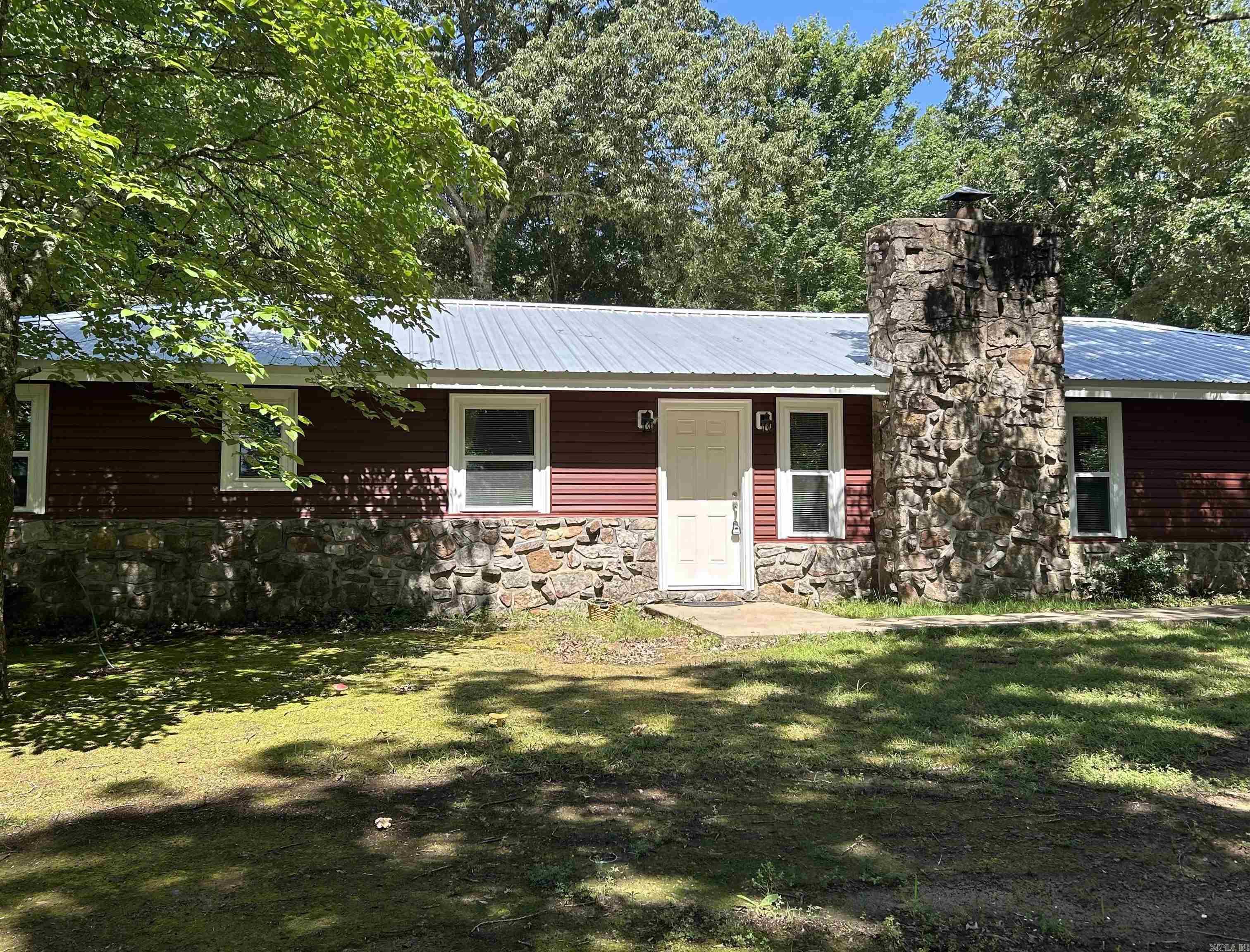 Looking for a place to call home with a new roof, siding, windows, and vanitys thats also VA approved? Well this 4 bedroom, 2 bathroom boasts an open kitchen, year round lake view, and 480 sqft guest house, all while being just a few minutes to the lake but still secluded enough for privacy while enjoying nature. All furnishings and appliances are negotiable. Call today for a showing !!!! Agents see agent remarks.