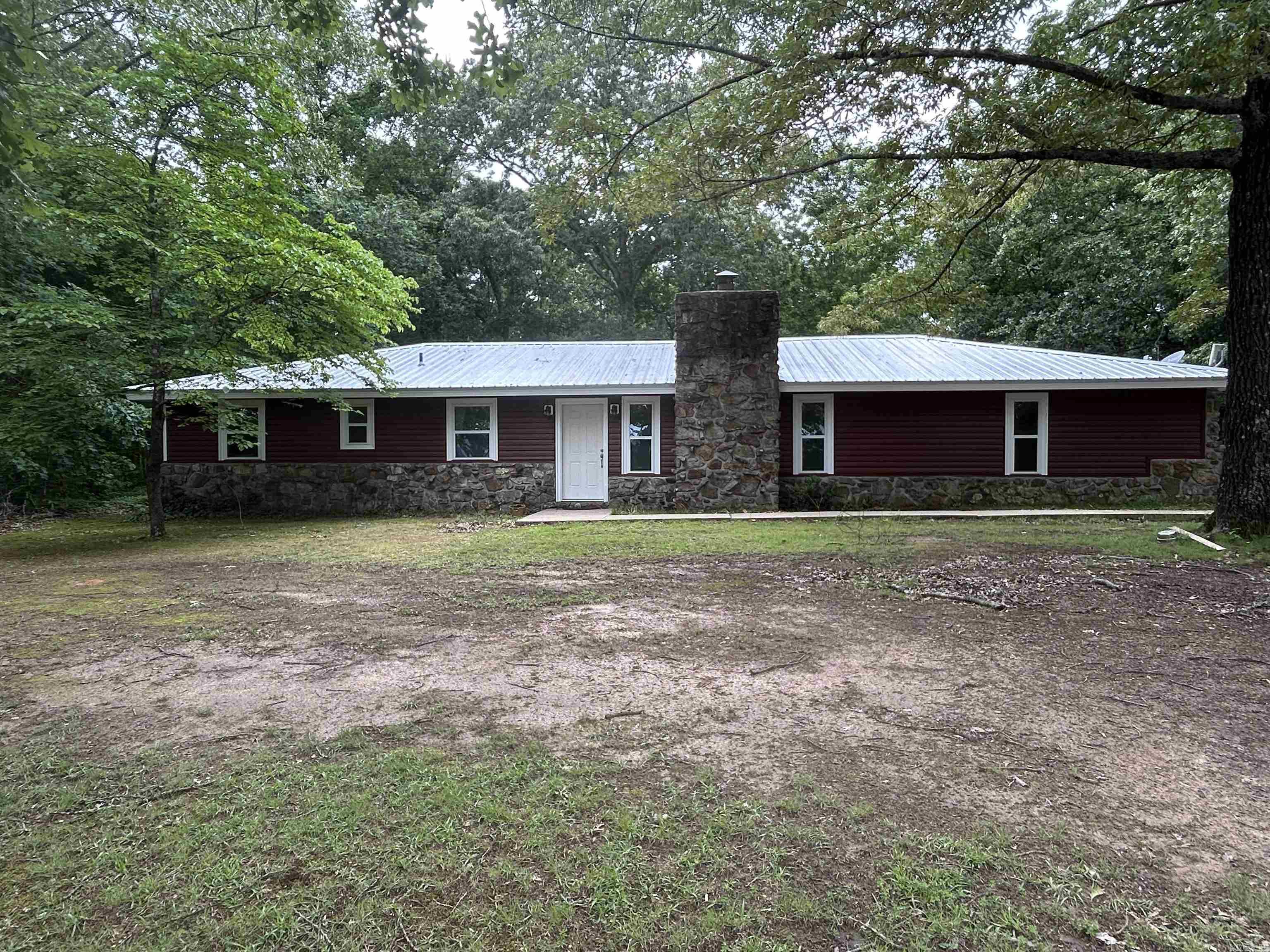 Experience the best of both worlds! This 4 bedroom, 2 bathroom boasts an open kitchen, lake view, and a guest house, all while being close to the lake. But still secluded enough for peace. All furnishings and appliances are negotiable. Call today for a showing !!!! Agents see agent remarks.