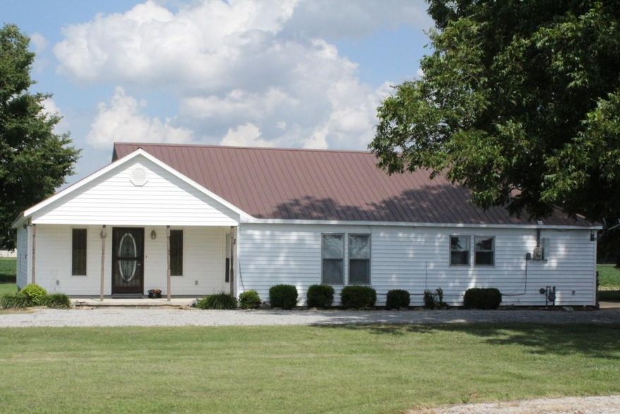 This charming home on an acre lot has been meticulously maintained. The inviting family room features a vaulted ceiling, fireplace & plush neutral carpet. A huge kitchen offers abundant cabinetry, an island, tiled backsplash, breakfast bar & easy access to dining room. The spacious master boasts a warm color scheme, neutral carpet, dressing area & walk-in shower. Additional amenities include dual vanities & custom tiled walk-in shower in second bath, detached carport & large workshop with electricity & gas.