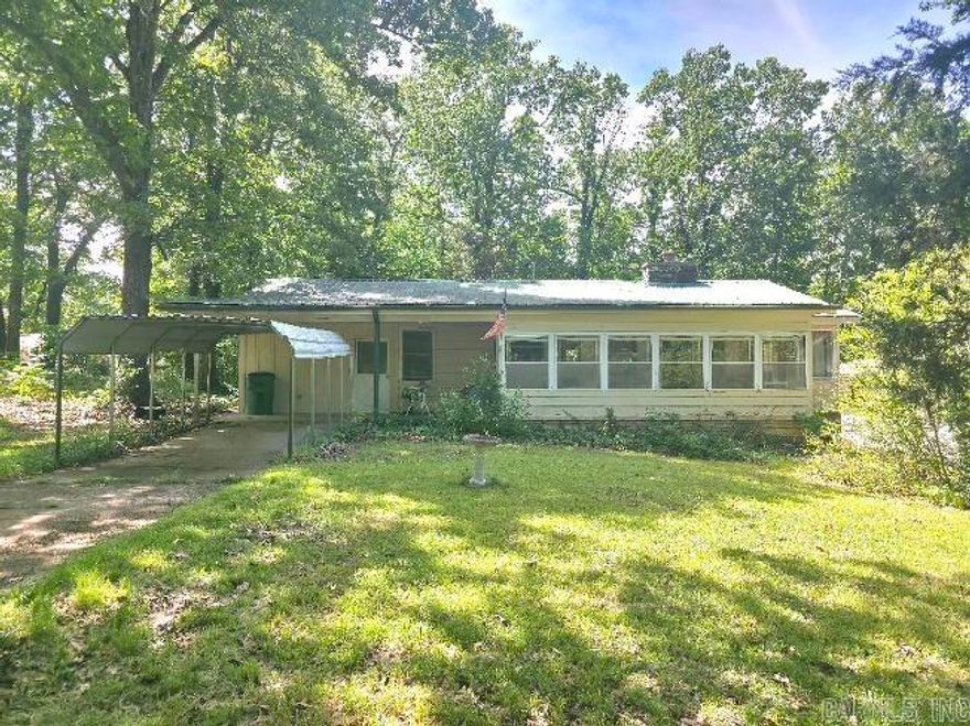 Discover the perfect blend of comfort and tranquility in this charming 1,280-square-foot home located in the heart of Cherokee Village, AR. Nestled on a lush quarter-acre lot, this property offers the peaceful lifestyle you’ve been dreaming of, just minutes from the serene waters of Lake Sequoyah.  Enjoy the timeless beauty of original hardwood floors throughout the living areas, paired with durable, easy-to-clean linoleum in the bathrooms. At 1,280 square feet, this 2-bedroom home offers a generous footprint with a practical 1.5-bath configuration, perfect for a primary residence or a low-maintenance vacation retreat.  Windows throughout capture the wooded beauty of the Ozarks, creating a bright and airy atmosphere. Cherokee Village isn't just a location; it's a lifestyle. Owners enjoy access to seven private lakes, two 18-hole championship golf courses, a swimming pool, and miles of scenic hiking trails.  The .25-acre lot provides ample space for gardening, a fire pit, or simply watching the local deer and birdlife from your backyard.