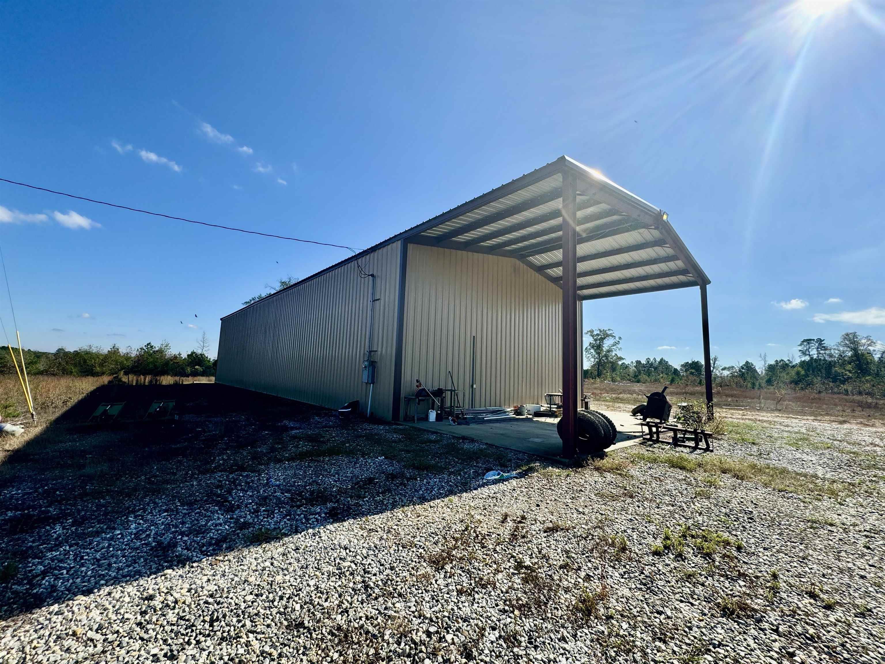 2016 Sq' 4 bed 2 bath Mobile Home on 120 acres. The boundary's are clearly marked with fencing. All of the fence posts are in place and about 80-85% of the fencing is complete. The property also includes a 40x100 commercial grade shop with 10' covered front porch. Also includes a small guest house.