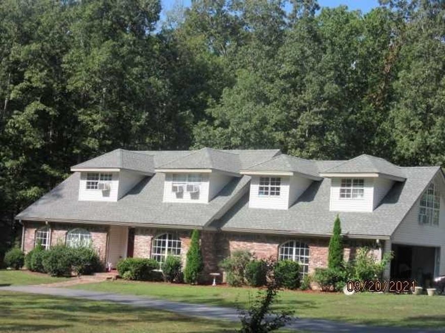 4 bedroom, 3 1/2 baths on 5 1/2 acres and 2000 sf shop.  FSBO