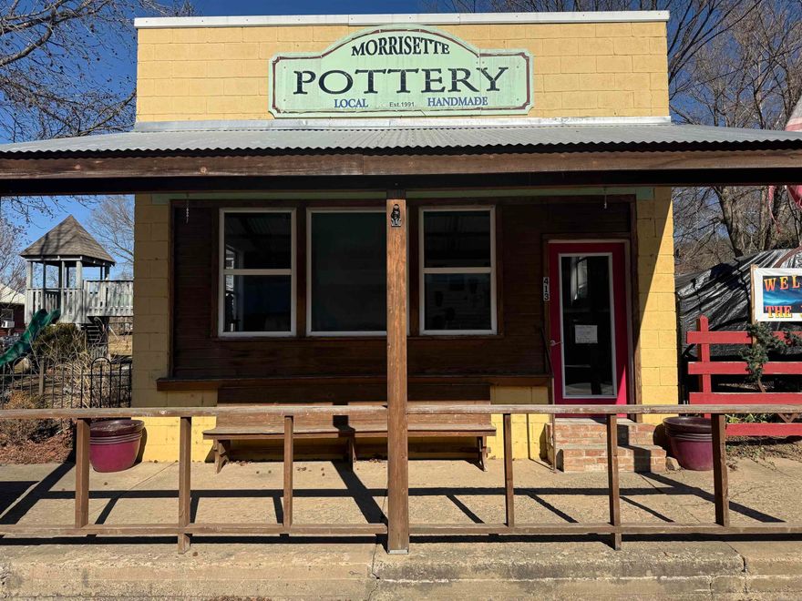 Commercial opportunity in the heart of downtown Leslie, Arkansas! This 720± square foot Main Street building offers excellent visibility with approximately 2,300 vehicles per day (2024 data). The front storefront space is ideal for a boutique, art studio, gallery, office, or specialty retail business. Large display windows and direct sidewalk, access provide strong curb appeal and steady drive-by exposure.  The rear portion of the building is currently configured as a studio efficiency apartment and is rented, offering immediate income potential. Continue leasing for passive income, use as short-term rental, or convert to expanded commercial space.  Located in charming Leslie, surrounded by the Ozark Mountains and scenic streams, this property offers flexible mixed-use potential in a historic small-town setting. Great opportunity for entrepreneurs or investors seeking an affordable downtown presence with built-in revenue.