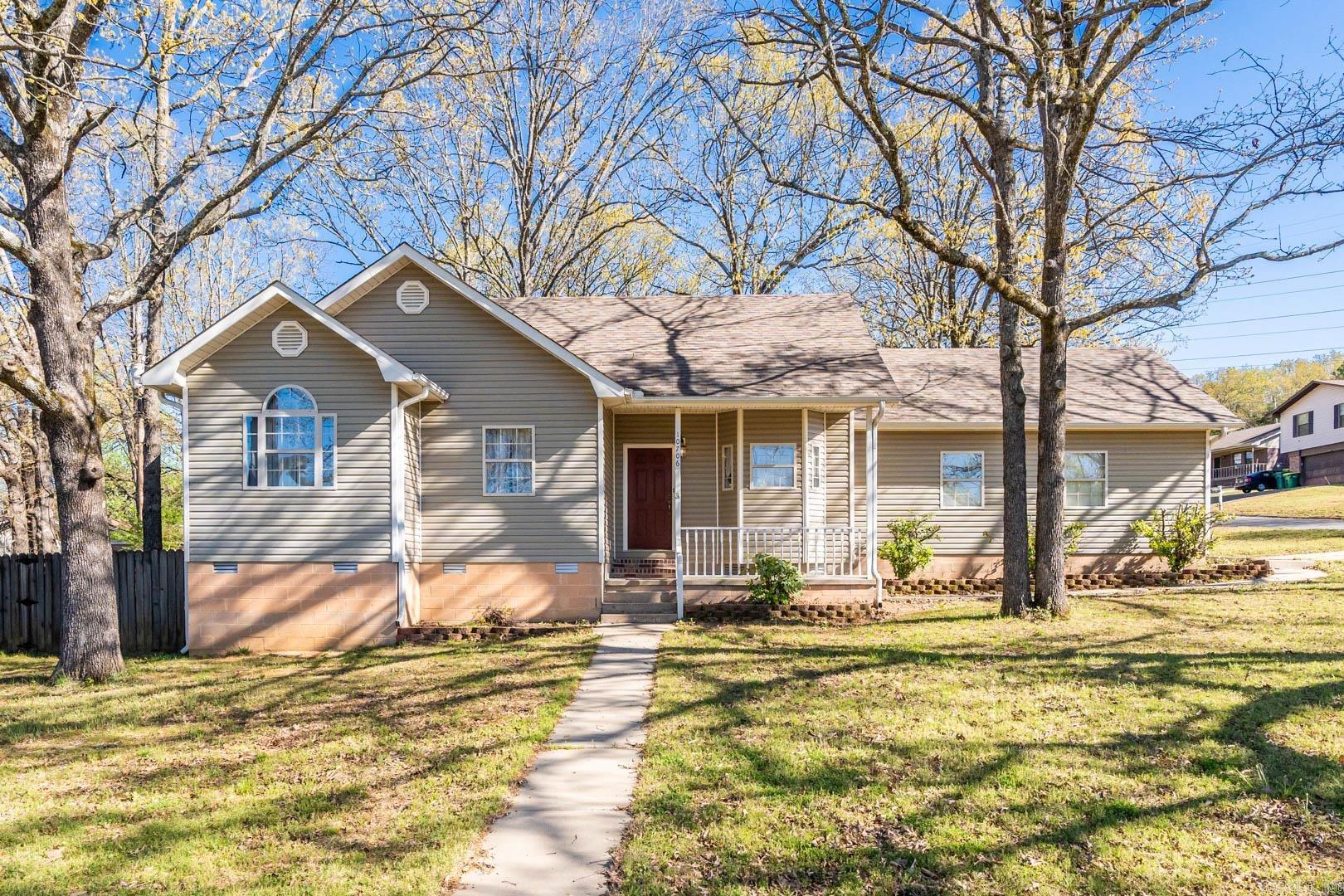 This charming home on a private corner lot has many updates including new luxury vinyl flooring, beautiful quartz countertops, freshly painted upper cabinets, and a lovely backsplash. The whole kitchen welcomes an abundance of natural light making it a place you want to be. The rest of the home has fresh paint on the walls, doors, and trim to make the space fresh for you. Primary bath has a beautiful soaking tub and two separate sinks. New architectural shingle roof was installed in November 2020.