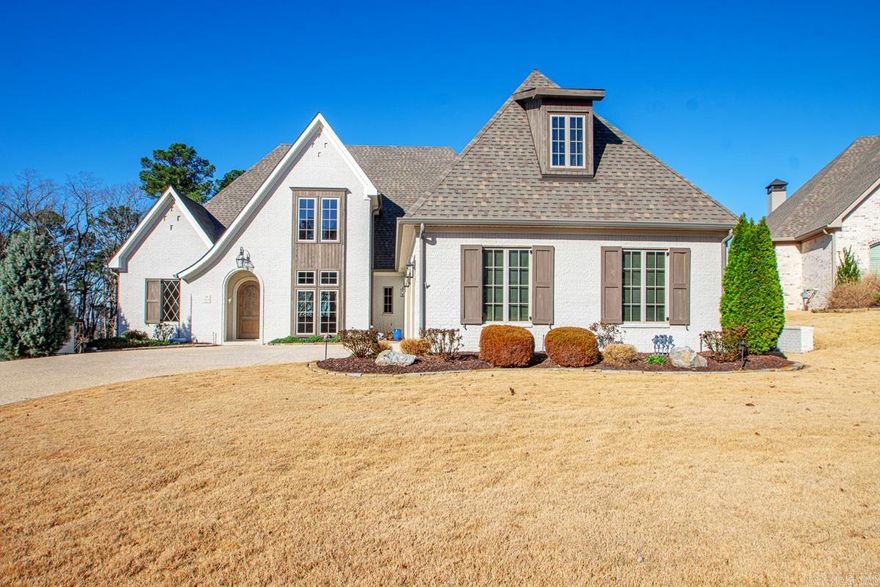 Charming European-inspired touches in this warm, traditional 4 bedroom, 4 1/2 bath home built by Jackie Stevens.  Upon entering, you are greeted to a wall of windows showcasing the private covered back patio with wood-burning fireplace overlooking a gorgeous greenspace.  Primary and guest suites are down along with an office with big closet, formal & eat-in-dining, and 1/2 bath.  Gourmet kitchen has gas range, double ovens, and an amazing huge pantry with wine fridge.  The hidden staircase leads to 2 more bedrooms, 2 baths, & bonus room.  TONS of storage.  Oversized 3 car garage (with careful maneuvering Seller has fit 4 SUVS during storms).  Primary bedroom features wall of windows to greenspace, private patio off of bath (outdoor shower), large closet with island of built-ins connected to laundry room.