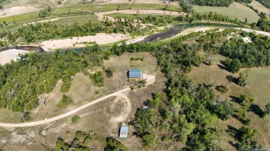 100+ Acre Recreational Farm with Home on Crooked Creek — Outdoor Paradise!  Welcome to your private retreat nestled on 100+ acres of stunning, multi-use land bordered on two sides by the pristine Crooked Creek. Whether you’re looking for a recreational haven, a working farm, or a peaceful place to call home, this property has it all. Enjoy floating, fishing, and hunting right outside your door in a true sportsman’s paradise. The land features two ponds, gently rolling pasture, and wooded areas teeming with wildlife. A barn, cow waterer, hayfield and two additional wells make this property ideal for cattle, horses, or hobby farming or could open up opportunities to build a new home or hook up an RV/mobile home. The cozy 2BR/2BA home offers comfort and charm with a large deck overlooking the creek—the perfect place to sip your morning coffee while taking in the sounds of nature. The unfinished basement provides room to expand or customize to your needs. Call for showing today!