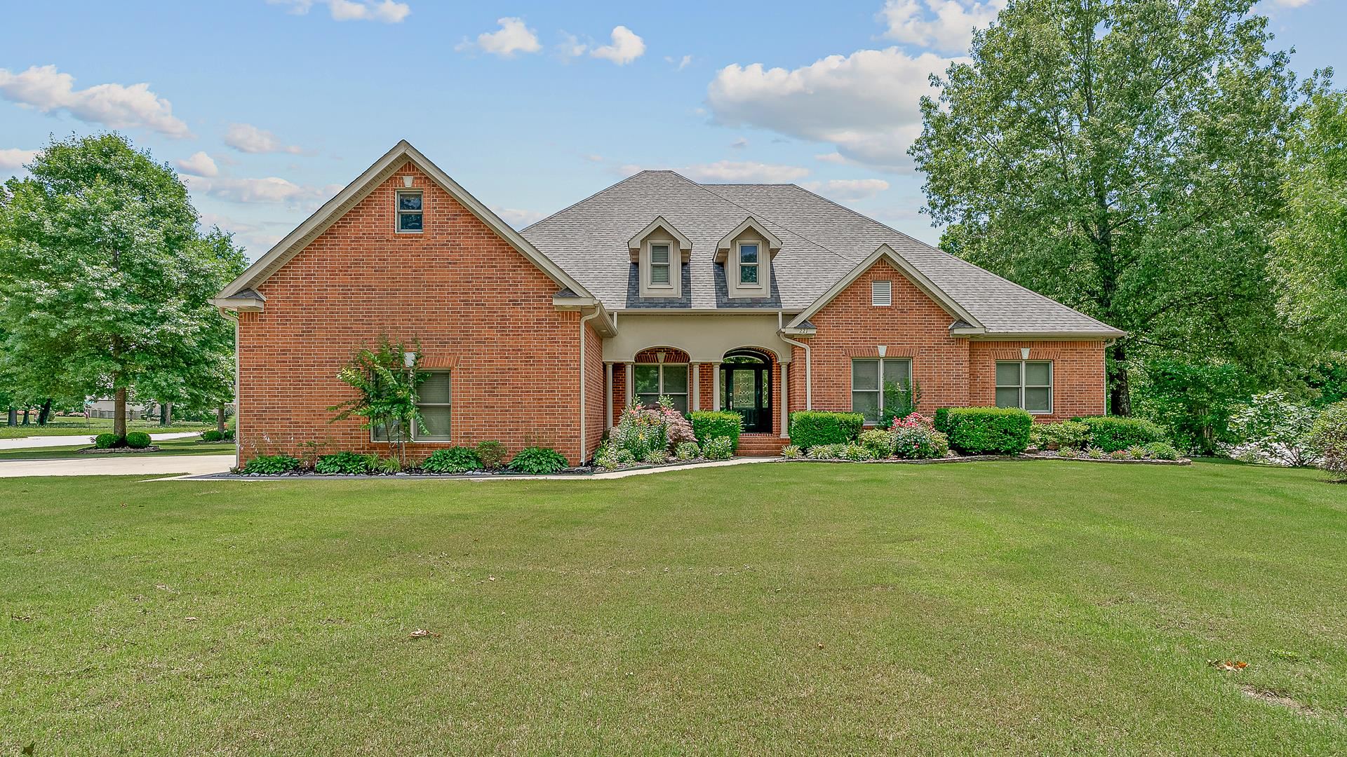 Located in the sought-after Dunwoody Estates, this beautifully maintained home sits on a 0.65-acre lot with a sprinkler system and features a sparkling pool, pool house with a half-bath, and an oversized 3-car garage with a sink and closet. The main level showcases three-quarter inch hardwood floors, ceramic tiles in the kitchen and baths, a spacious living room, 4 bedrooms, and 3.5 bathrooms, while a bonus room upstairs offers a full bath and closet. Additional highlights include a HydroTemp geothermal HVAC system (ground-source, zoned front and back), built-in safe room, office, sunroom, arched doorways, high ceiling, crown molding, two fireplaces with gas logs (including one in the hearth room), two convection ovens, a warming oven, a security system, and a new roof and gutters installed in 2022. Valley View Schools.
