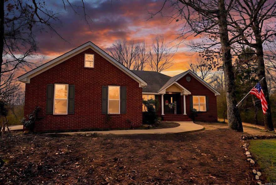 Brick home perched on a hill in Glenwood offering privacy while still being just minutes from town conveniences. This stately 3 bedroom, 2 bath home features approximately 1,995 sq ft of comfortable living space in the Centerpoint School District.  Inside, you’ll find an open-concept living and kitchen area designed for both everyday living and entertaining. In addition to the three spacious bedrooms, there is a versatile bonus room that could easily serve as a formal dining room, home office, or even a 4th bedroom.  Enjoy outdoor living from the large back deck overlooking the backyard, offering great space for gatherings or relaxing evenings. The property also includes a garage and a storage building, providing ample room for tools, hobbies, or extra storage.  Conveniently located near the Caddo River and the Glenwood Country Club golf course, this home combines convenience with a setting that feels set apart.