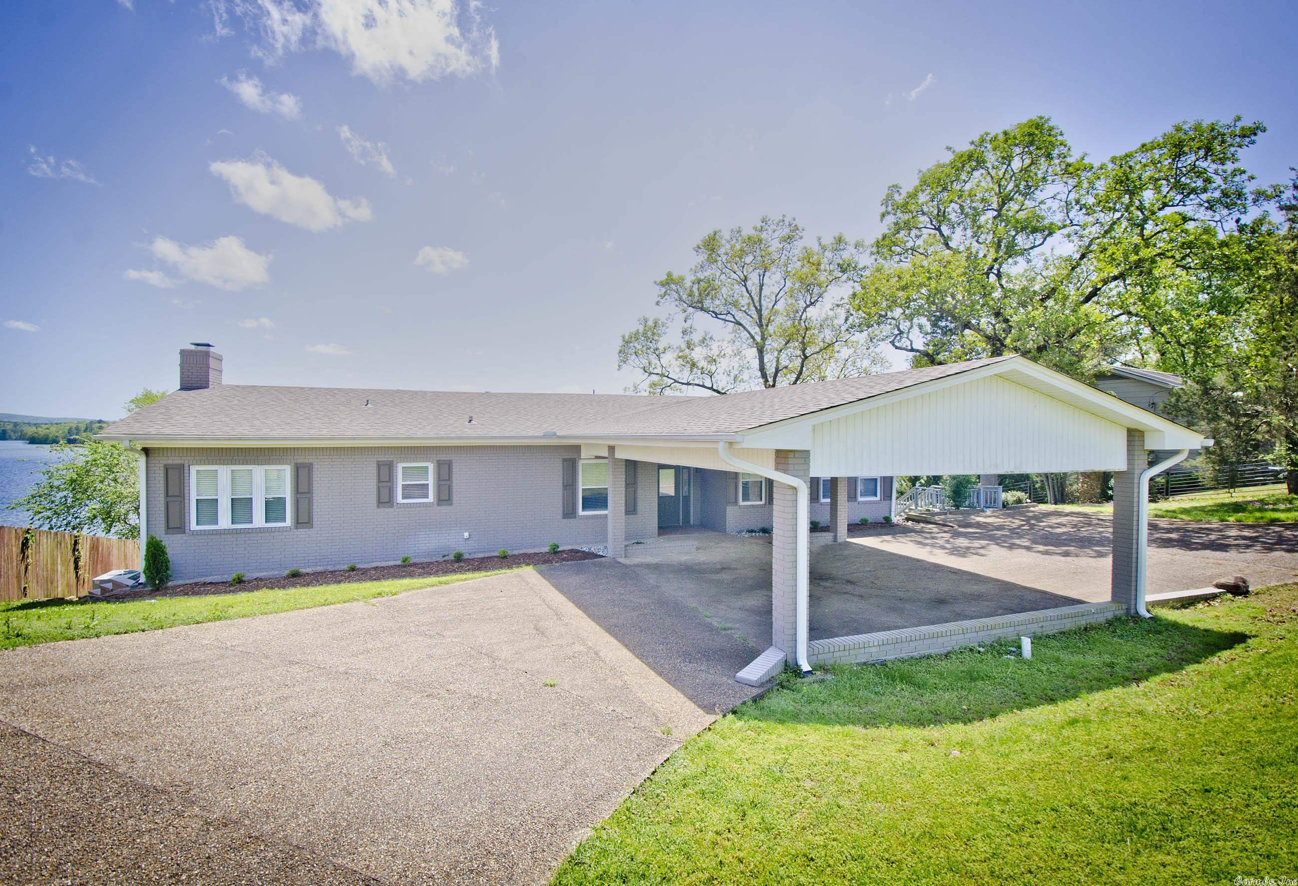 Welcome to Lake Hamilton! This home has the BIG lake view that you have been dreaming of! Lovely updates throughout, two living areas, a large deck and patio area, covered boat dock, and close to everything Hot Springs has to offer! (Did I mention that view)?