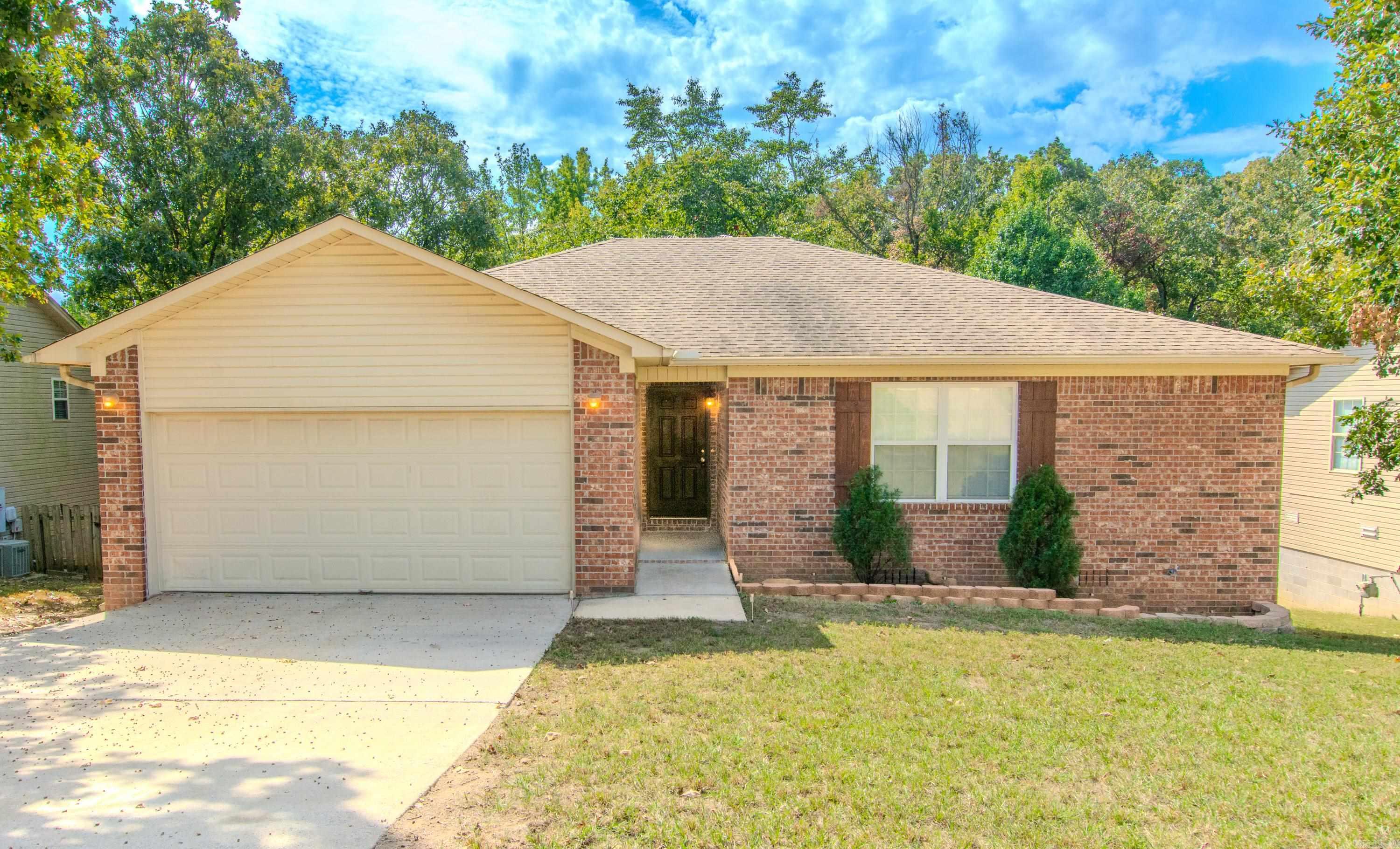 What a deal—under $200K and qualifies for ZERO downpayment loan.  Call for detials on this beautiful one-level home offers 3 bedrooms, 2 baths, and an inviting, oversized den perfect for relaxing or entertaining. The semi-open kitchen flows nicely into the dining area and den, creating a comfortable and functional layout. Wood-like flooring adds warmth and charm, while carpeted bedrooms provide a cozy retreat.  Large windows fill the home with natural light, and the back deck feels like a peaceful treehouse getaway—ideal for morning coffee or evening gatherings. The spacious primary suite features a luxurious jetted tub, double vanity, and separate shower. With a laundry room, two-car garage, and a fantastic price, this home is truly a must-see!