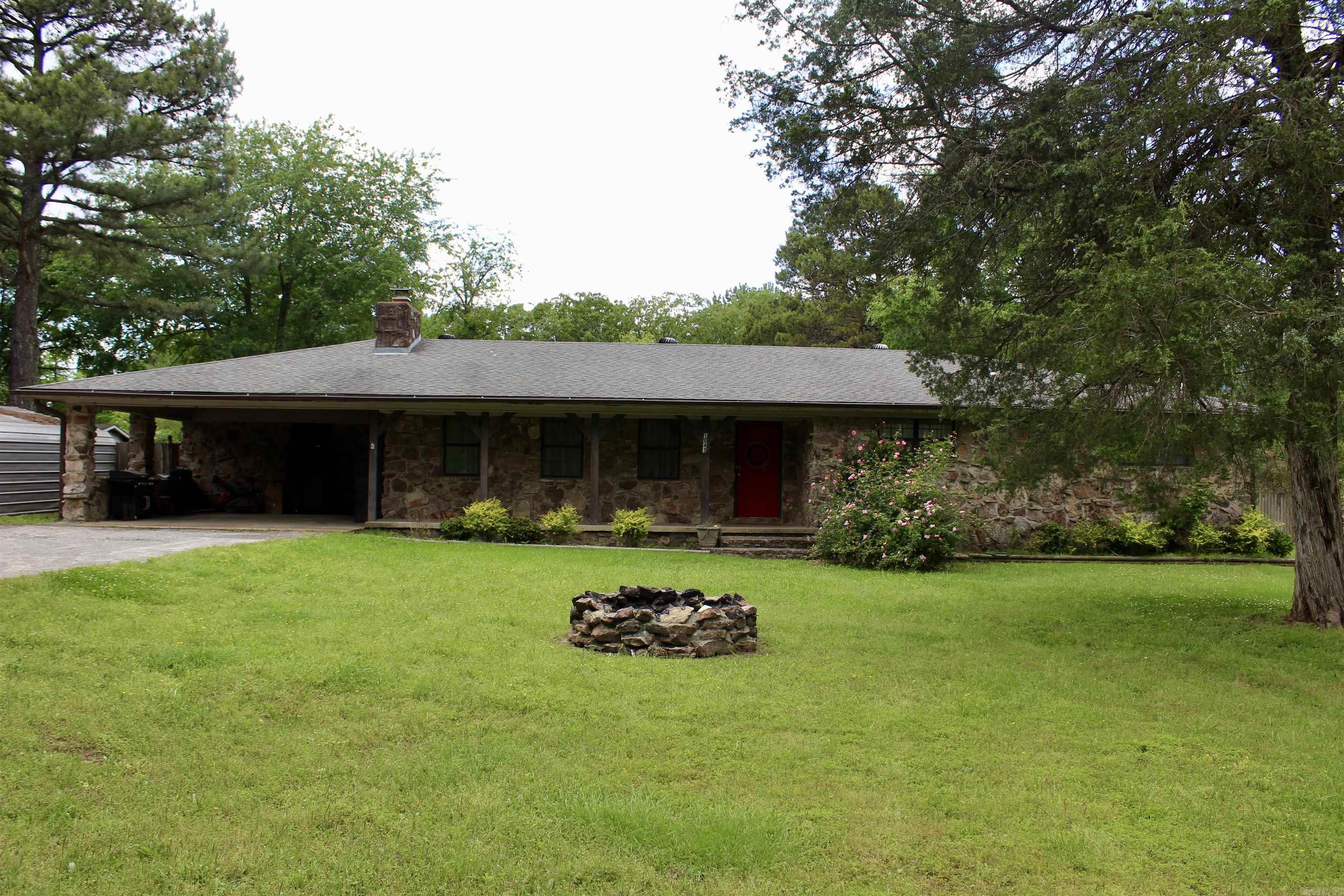 If you're on the lookout for a charming fixer-upper with plenty of space and potential, this country home might be just what you need. Nestled on over an acre of land, it offers a unique opportunity for those with a knack for transformation. The home features a solid structure, ensuring a sturdy foundation for your renovation dreams. Despite its age, it has been well maintained, making it a promising investment. Recent updates to the property include a roof that was installed just ten years ago. The fireplace, serviced annually by Arkansas Travelers, has a new stainless sleeve to ensure safety and efficiency. Additionally, the septic system has been upgraded with a new junction box and additional field lines for reliable functionality. There's also a new survey, providing clear and current property boundaries. This spacious home is ideal for growing families, offering ample space to create your ideal living environment. With the acreage, there's room for gardens, outdoor activities, and more. If you're interested in exploring the potential of this charming country home, let's arrange a visit. It's the perfect canvas for your dreams!