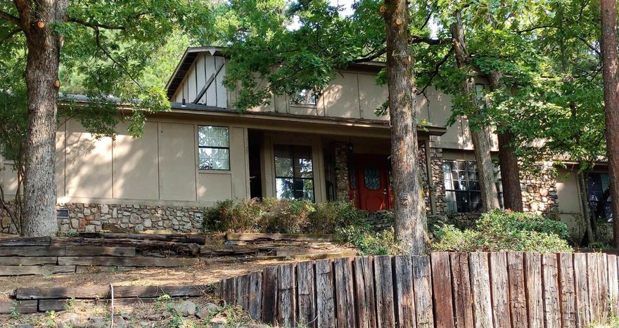 New Roof!  Great Floor Plan in this Custom Built Builders Home.  The Main Level includes the Master Bedroom Suite, Guest Bedroom, Kitchen, Walk-in Pantry, Laundry Room, Living Room/Dining Room with Wet Bar and Fireplace, and 2 1/2 Baths.  The Upstairs includes 4 Large Bedrooms with 2 Bathrooms, that's 6 Bedrooms and 4 1/2 Baths Total in this 3,470 Square Foot Home.   This Retreat is on a Private Large Wooded 1.18 Acre Lot with Extra Landscaping.   Agent Remarks