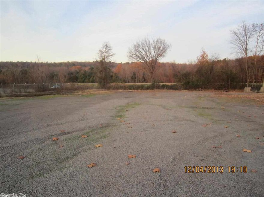 Over 1 acre with HWY 64 and I-40 frontage. Concrete slab available for a 6,000sqft commercial building. Lot improved and ready for construction.