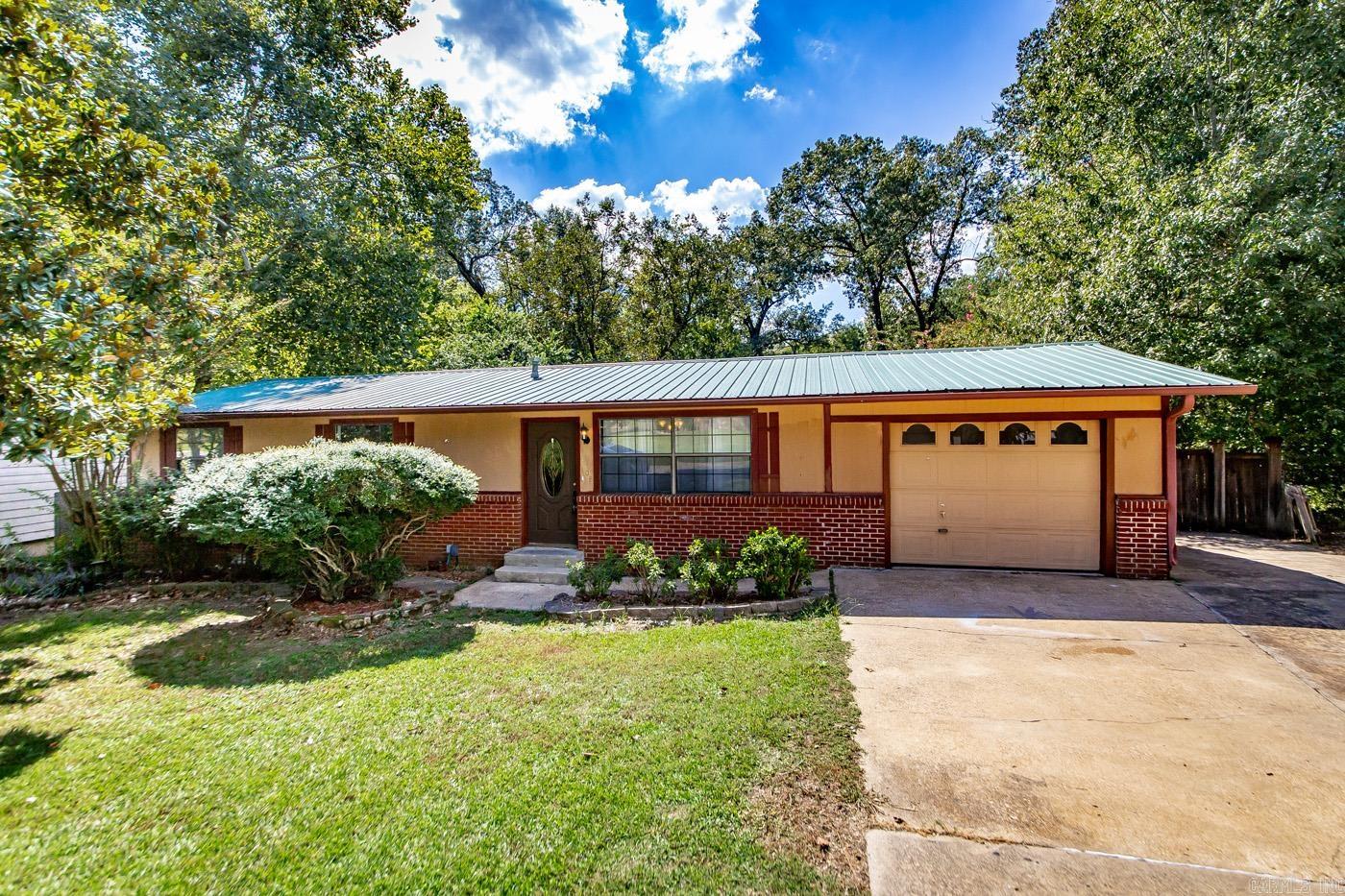 Benton Investor/First-Time Buyer Special! Don't miss this opportunity, this charming home, making it an incredible value for a first-time homebuyer or a savvy investor. This home has been a successful rental for many years bringing in $1375 a month. The property features 3 bedrooms and 1.5 bathrooms with a versatile layout that includes two living rooms, a laundry room, and a bonus room, providing plenty of space for family and guests. Outside, you'll find a huge fenced-in backyard with a nice back deck perfect for peace and quiet, along with a convenient storage shed. Recent updates include fresh paint and new flooring, giving the home a clean, modern feel. Brand new water heater 2023, metal roof, and new 2022 HVAC that has been serviced yearly. This one is a must-see! Call me today for your private showing.