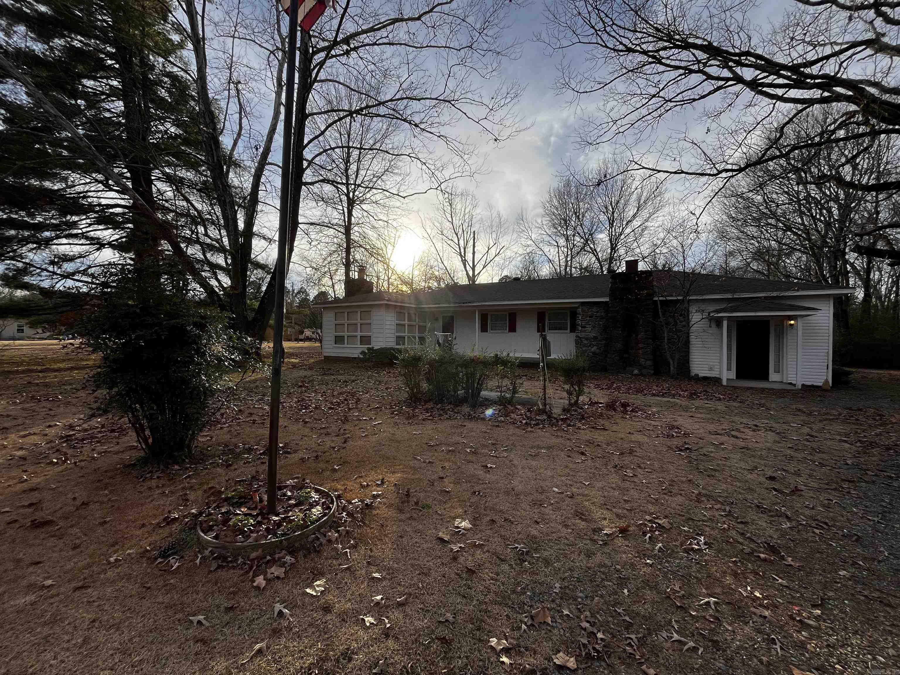 Country living ~ this property sits on approximately 2.16 acres with a small pond. Small workshop and covered carport located behind the house. New roof installed December 2023. **** Seller is selling the house AS IS WHERE IS