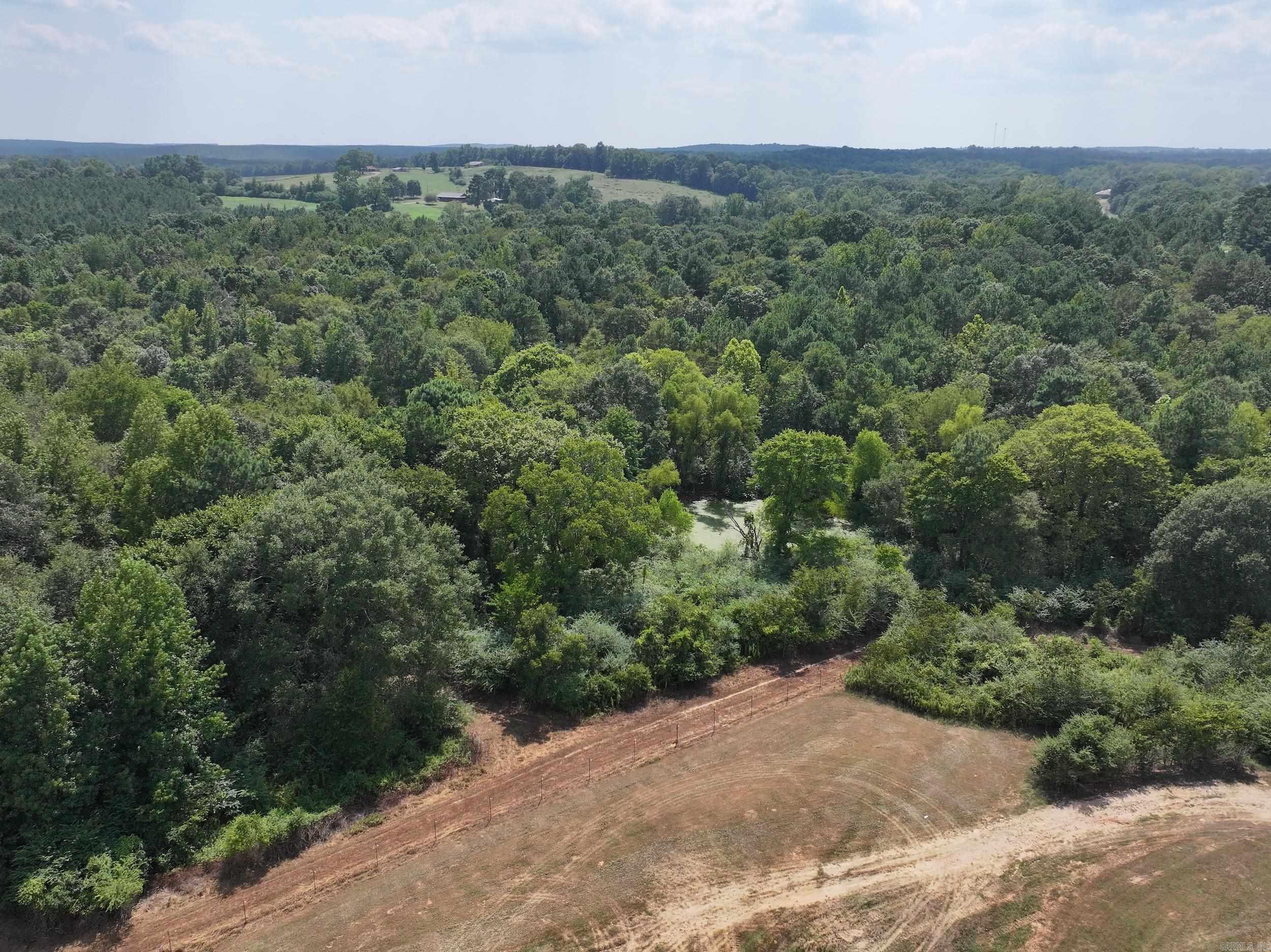 Explore the potential of this beautiful 34+/- acre property located right off Highway 70 in Newhope. With nearly the entire tractāexcluding just about ½ acreācompletely fenced, this land is ready for a variety of uses. It is currently used for recreational hunting. A small pond and a seasonal creek add charm and recreational appeal. The gently rolling terrain offers multiple buildable locations, ideal for your dream home, cabin, or retreat. Utilities are conveniently available at the highway for easy access. Whether you're looking to build, invest, or enjoy as a recreational escape, this versatile parcel offers the perfect mix of privacy, accessibility, and natural beauty. Schedule your showing today!