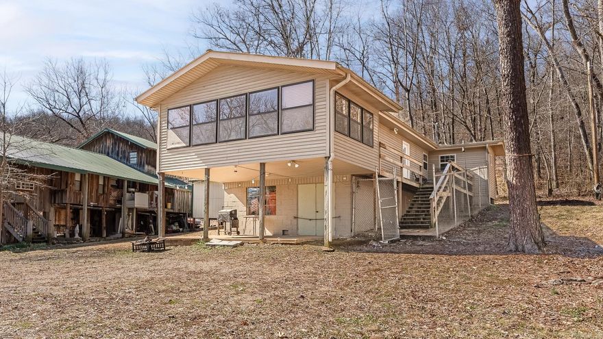 Discover the untapped potential of this charming cabin ?? nestled on the banks of the Spring River ?? in Hardy, Arkansas. With a generous living space of 1133 square feet, plus a 520 square foot basement, this property is currently designed to accommodate up to 12 people ???????????, making it an ideal retreat for large families or groups. Priced at an attractive $150,000 ??, this cabin represents a unique opportunity for the visionary buyer. Situated within a secure gated community ??, residents are ensured exclusive access to community parks ??, Myatt Creek, and the breathtaking Spring River. The property encompasses two lots, offering ample space for expansion or customization. Although in need of updates, once renovated, the after-repair value (ARV) is projected to soar well above $200,000 ??. Seize the opportunity to own and transform this hidden gem ?? into your dream riverside getaway.