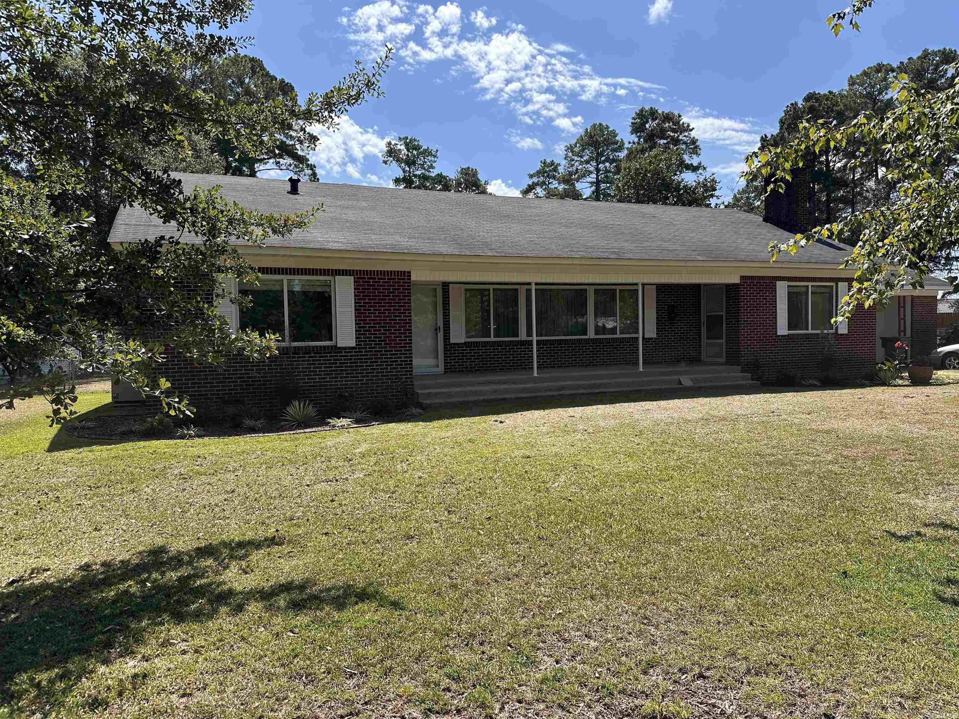 This well built home sits on over 1 acre with 2 outbuildings. The 3 bedrooms are large with 2 nice sized bathrooms. Fresh paint throughout, new cabinet hardware in the kitchen, plus double ovens and new sink fixtures. 2 living areas with fireplace in the family room. Wood floors throughout. Off the kitchen they have a great sunroom with laundry room. Not only is front yard big with the house set back but there is a huge backyard with two outbuildings. Lots of potential at a great price. Seller has a few remainder items they are finishing up. Tough up painting, a transition strip at one bathroom and 2 doors to be rehung but it will all be done in a week.