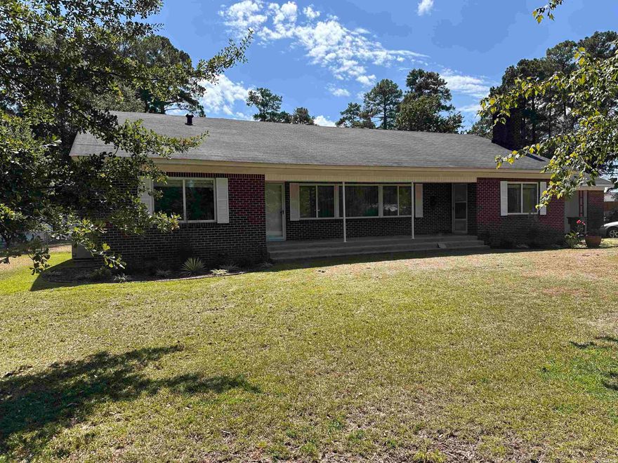 This well built home sits on over 1 acre with 2 outbuildings. The 3 bedrooms are large with 2 nice sized bathrooms. Fresh paint throughout, new cabinet hardware in the kitchen, plus double ovens and new sink fixtures. 2 living areas with fireplace in the family room. Wood floors throughout. Off the kitchen they have a great sunroom with laundry room. Not only is front yard big with the house set back but there is a huge backyard with two outbuildings. Lots of potential at a great price. Seller has a few remainder items they are finishing up. Tough up painting, a transition strip at one bathroom and 2 doors to be rehung but it will all be done in a week.