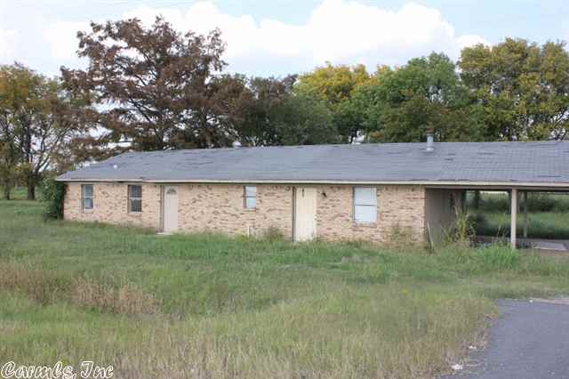 Highway frontage with shop that would make a good hobby shop, flea market, or other business if needed. Home was in the middle of remodling when they put on the market so it will be a fixer upper. May also be fixed up as a duplex