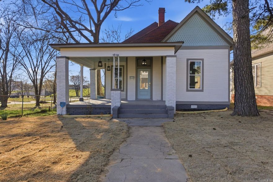 1518 Welch Street blends early-1900s architectural character with thoughtful modern updates in the heart of downtown Little Rock. From the wide, covered front porch framed by classic brick columns to the timeless gabled roofline, the exterior reflects the historic charm that defines this neighborhood. Inside, you’ll find a bright, refreshed interior with tall ceilings, abundant natural light, and a fully updated kitchen featuring shaker-style cabinetry, quartz countertops, subway tile backsplash, and stainless steel appliances. Clean finishes and warm flooring create a move-in-ready feel while preserving the home’s original proportions and personality. Positioned near SoMa, Pettaway, local restaurants, and the River Trail, this home offers walkability, community energy, and long-term upside — all at an approachable price point that makes downtown ownership attainable.