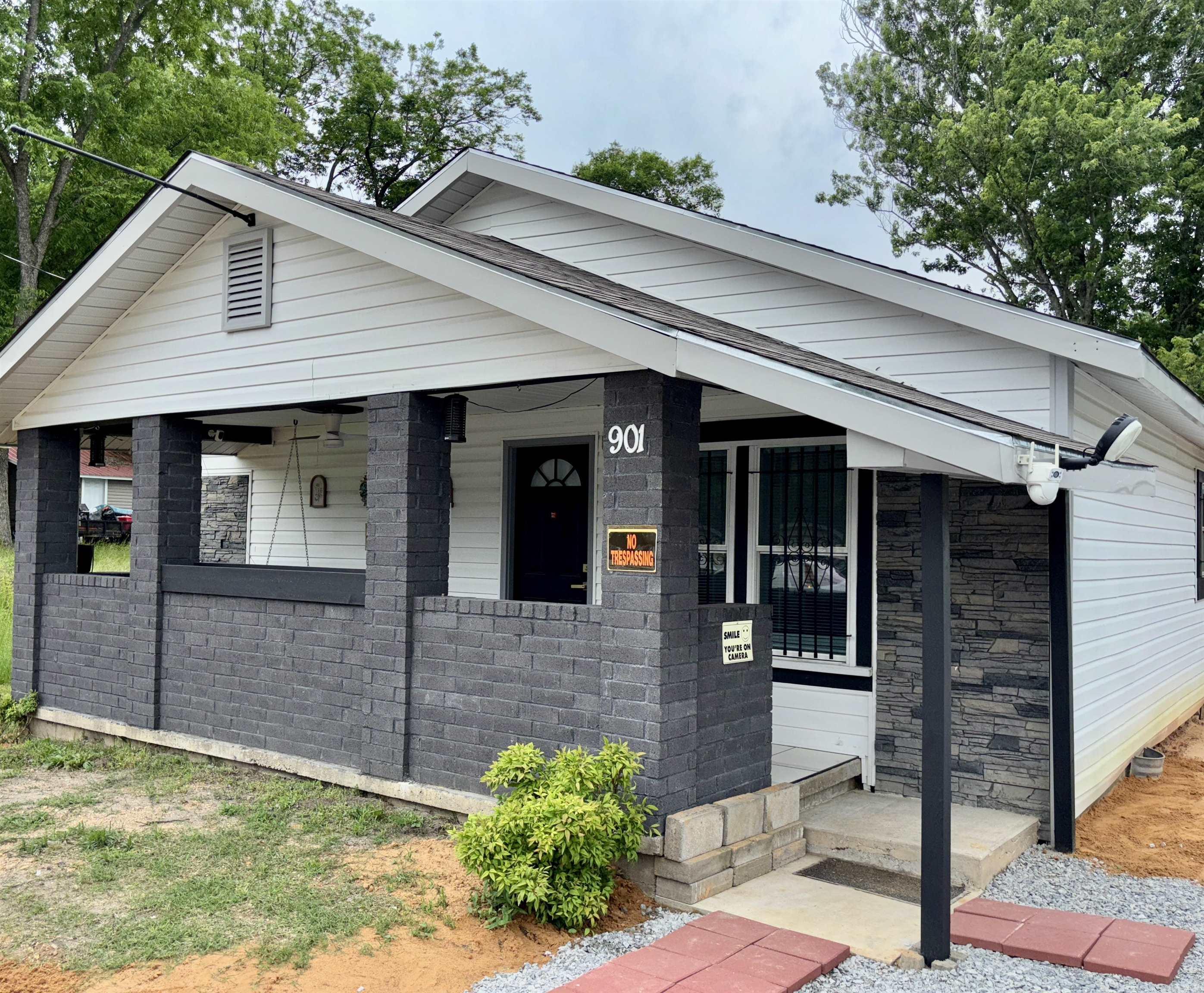 This home has been gutted to the studs and completely remodeled! NEW roof (2024). NEW plumbing and electrical, wiring / 200 amp service (2024). NEW siding, insulation and sheetrock (2024). Added 1/2 bath. NEW back deck. NEW appliances, NEW flooring. The 10x20' shop has an a/c unit and a partially finished interior, it's insulated and wired for electricity. The home is just 1 block walking distance to the mountain bike trail and just a few blocks from downtown Benton. Excellent location!! **Per seller train tracks next to property is a dead line, not in use**