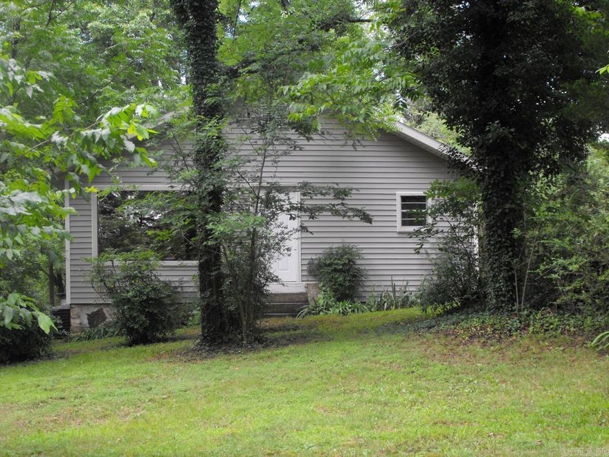 Nice 2BR/1BA home with CH/A tucked away on a VERY shady acre. Very private location. Home has big picture windows in Living Room and both Bedrooms.