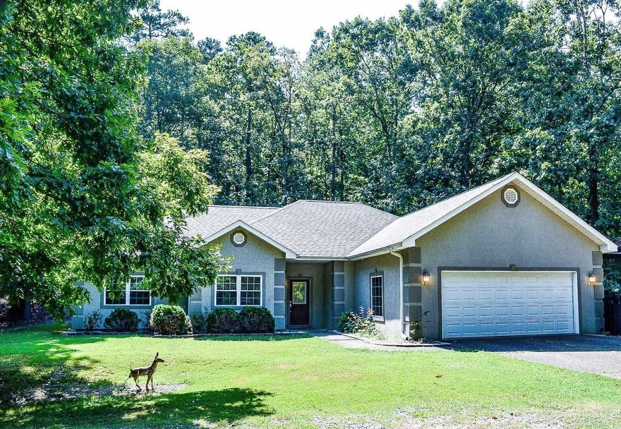 Add your design touch to this 4 bedroom, 2 bath home. Built in 2005, this home offers level lot, split bedroom floor plan, corner fireplace, eat-in kitchen, fuss free exterior and fenced yard. Laminate flooring  with carpet in the bedrooms.(carpet allowance of $ 5,000.00 will be offered). Convenient location just 2 miles from the West Gate shopping amenities. Easy access to one of our many walking trails. Hot Springs Village Property Association has a new member buy-in fee of $2,000.00 due and collected at closing.