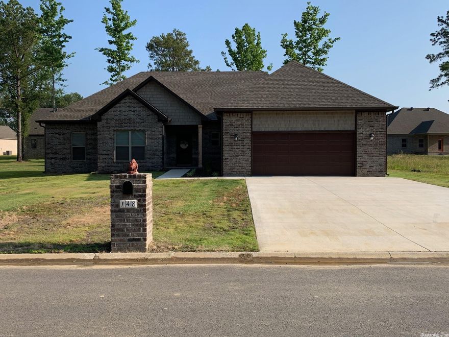 Beautiful 1 owner home in Hidden Valley Estates! This home offers open floor plan, hardwood look tile throughout, fireplace, custom trim, gutters and covered patio.  Kitchen features countertops, custom cabinets, breakfast bar, huge pantry with a window.  Main bedroom features wonderful walk in closets, 2 vanities, custom tiled shower.   AGENTS see remarks.