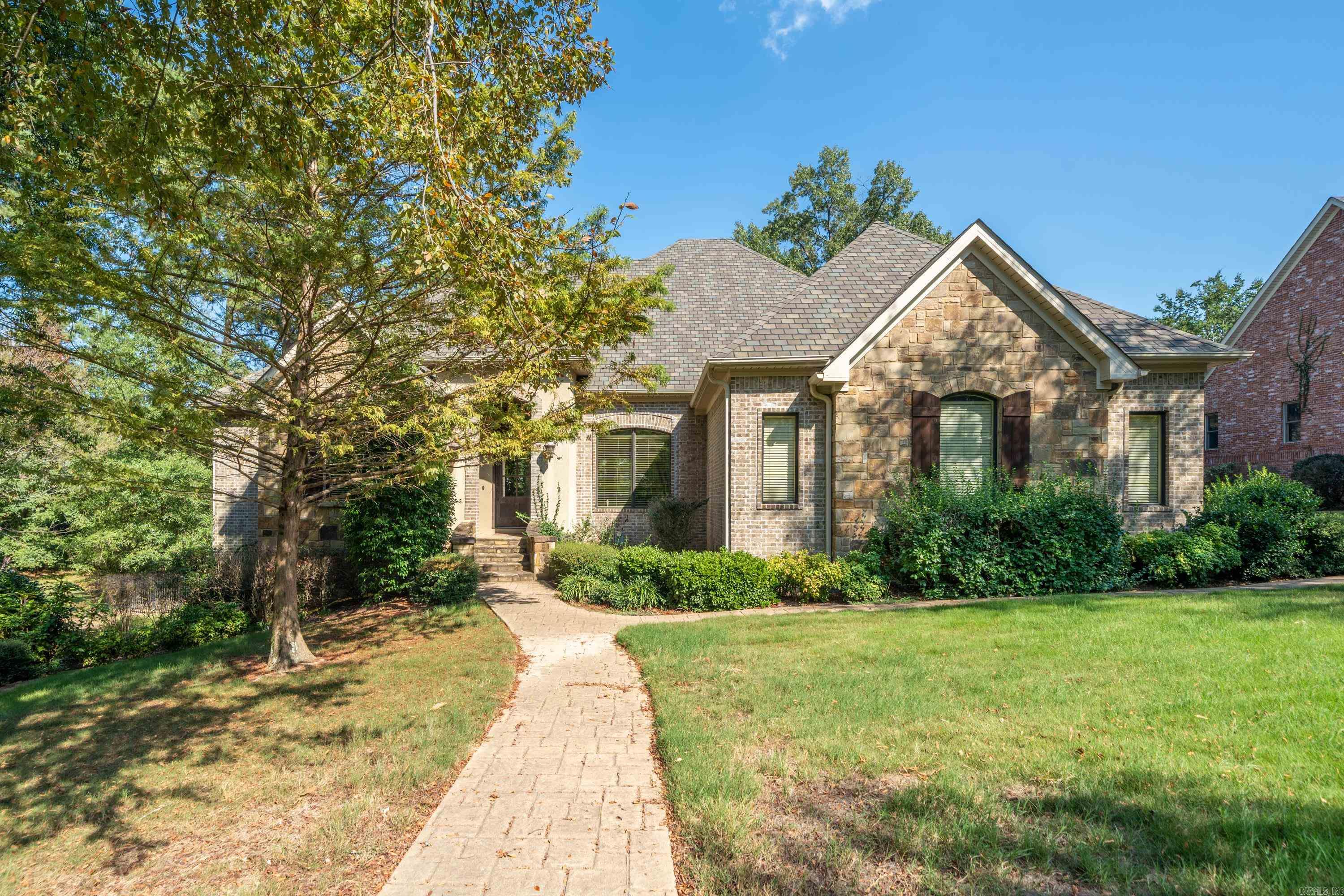 Welcome to your dream home in Lotus Valley Subdivision. This custom-built home offers an unparalleled blend of elegance, comfort, and modern convenience. As you step inside, you'll be greeted by the timeless beauty of hardwood floors that run throughout the main living areas. The heart of this home is the gourmet kitchen, adorned with stunning granite countertops and top-of-the-line stainless steel appliances. Whether you're preparing a casual meal or hosting a lavish dinner party, this kitchen is sure to impress. The spacious family room is perfect for gatherings with its grand proportions, a centerpiece fireplace, and a wealth of natural light filtering through large windows. The meticulously crafted crown molding and arched doorways add an extra layer of sophistication to the interior, making every room a visual delight. The home features a desirable jack and jill bath, connecting two generously sized bedrooms, offering convenience and privacy for family members or guests. Step outside onto the covered deck, where you can enjoy your morning coffee. The 3 garage bays provides ample space for vehicles and storage. The rear yard is enclosed by a stylish wrought iron fence.