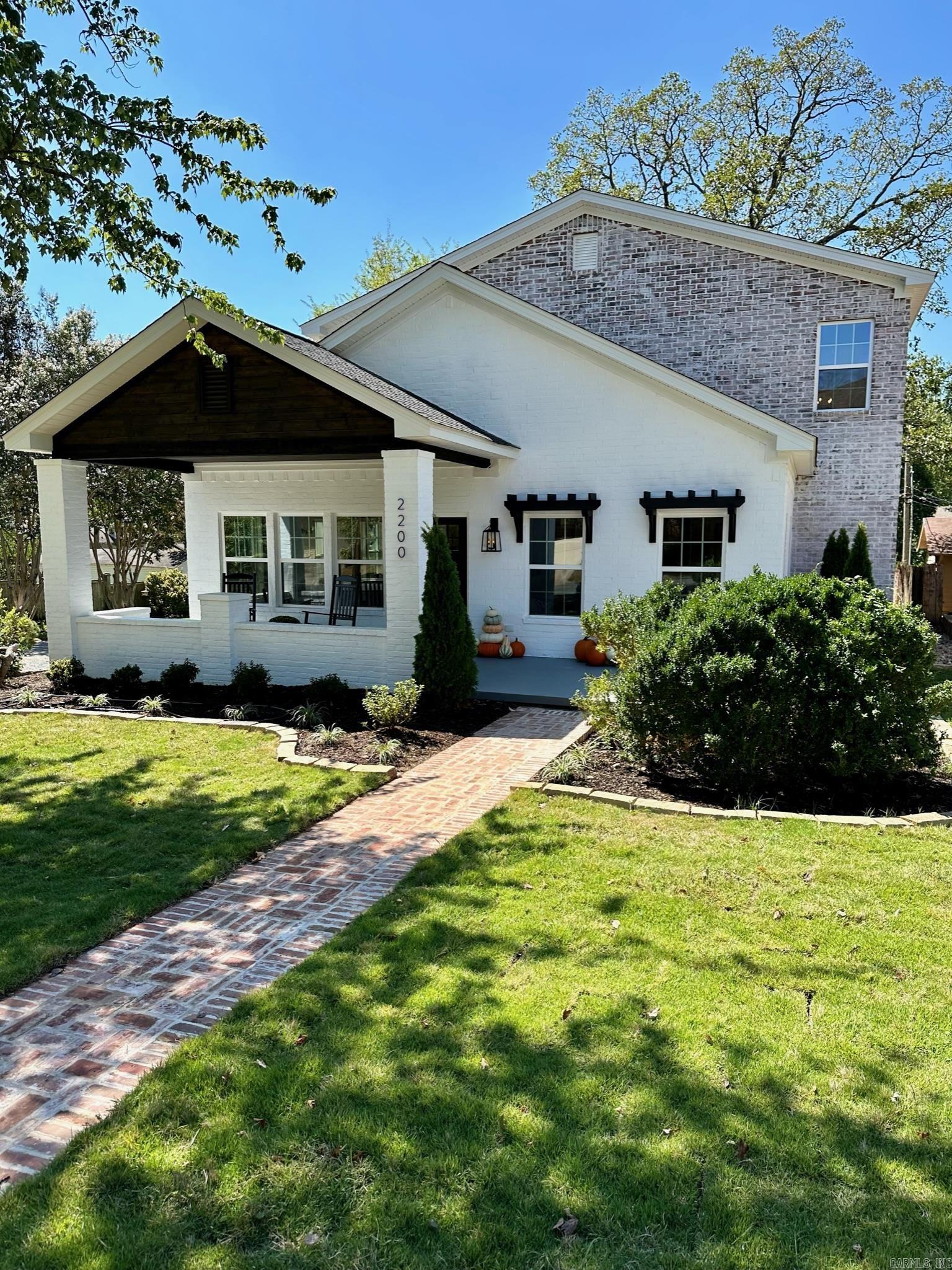 This is a stunning 5 bed, 4.5 bath within walking distance to restaurants and entertainment on Kavanaugh. From the front porch you are welcomed into the large open concept living room, dining area, and kitchen. The kitchen boasts an over-sized island, tons of beautiful shaker style cabinets, and quartz counter-tops. It is equipped with a 6 burner range, an oven and a half, and a large side by side refrigerator. Don’t miss the extra storage in the pantry which stores the microwave and ice maker. Through the kitchen is the laundry room with extra storage space, a sink, pull-out laundry hampers, and mud bench by the back door. The primary suite has a spa-like en suite bathroom with double vanities, a free-standing soaker tub, and a dual shower head walk-in shower with full body jets. Continue through the bathroom into the large walk-in closet with a built in chest of drawers, shelving system, and ample hanging space. On the main level, there is also a secondary suite with an en suite bathroom and walk-in closet. Upstairs you’ll find a second living area, 3 bedrooms, 2 baths, and a second laundry area. When complete there will be a detached 2 car carport with a storage room.