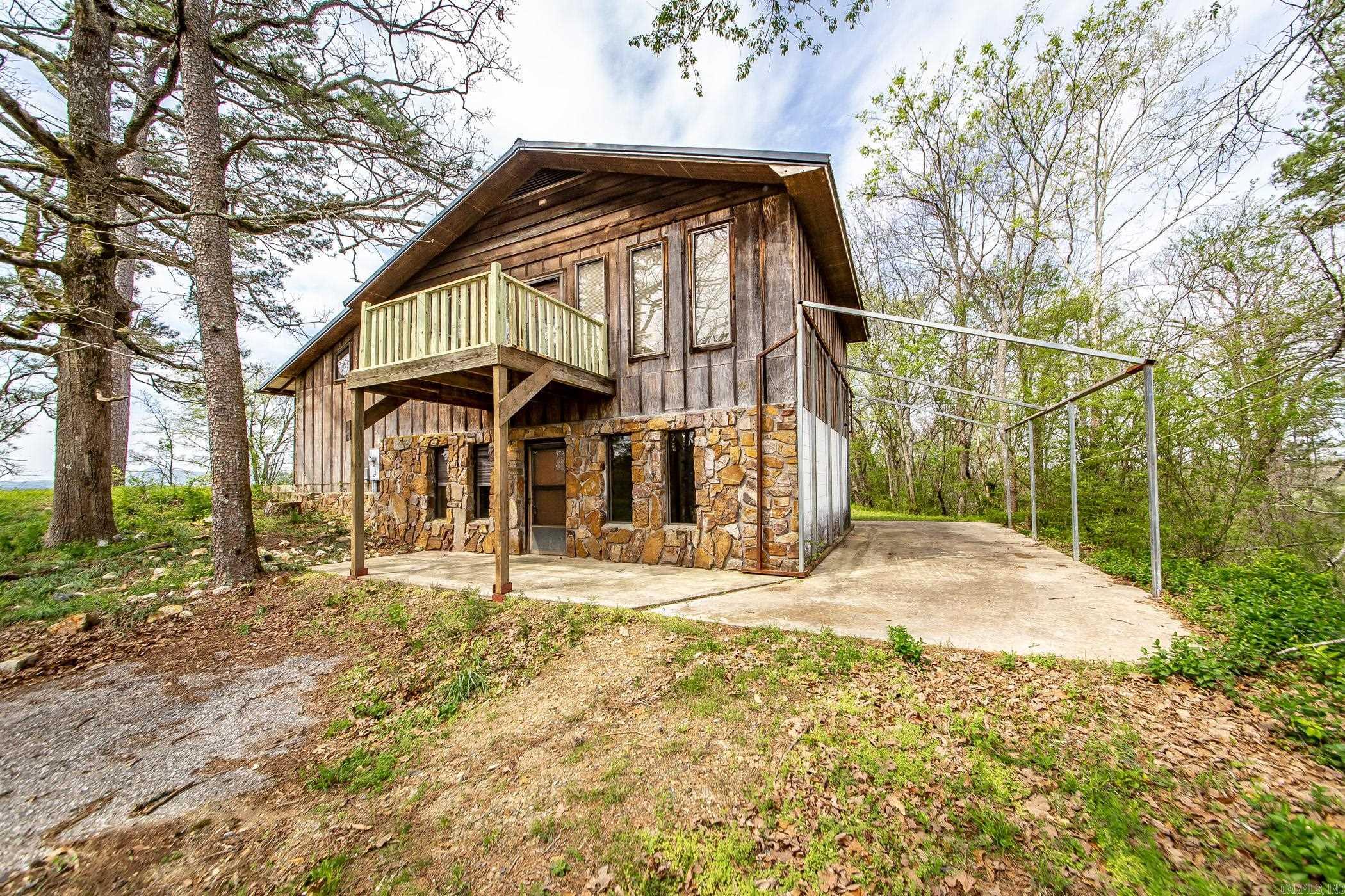 Full Two-Level Home with Shop on 2 Acres ā Norman, AR Set on a hill overlooking the town of Norman, this solid two-story home offers space, privacy, and flexibility on 2 peaceful acres. With 2 bedrooms, 2 full bathrooms, 2 kitchens, and separate entrances for each level, itās ideal for multi-generational living, rental income, or a home-based business. The upper level includes a spacious primary bedroom and bath, an open kitchen and living area, a large cedar walk-in closet, and two balconiesāone for sunrise, one for sunset. The lower level serves as a full mother-in-law suite with its own kitchen, living room, bedroom, bathroom, and bonus room for office or creative use. Plenty of parking and a large workshop down the hill, separate from the house, provide space for vehicles, storage, or projects. A versatile property with room to grow.