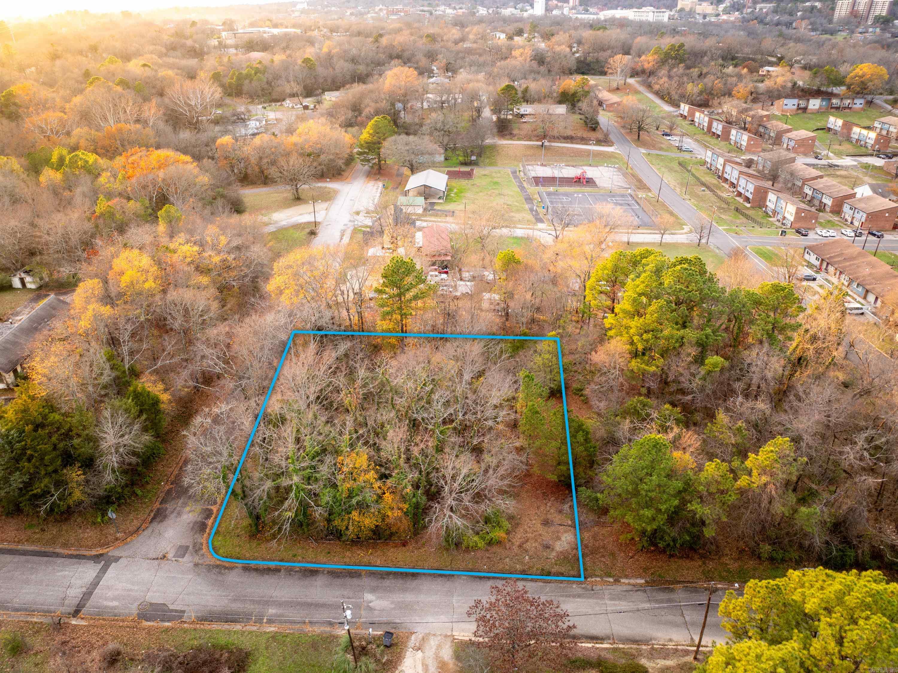 Three wooded residential lots on over half an acre, close to Downtown and Oaklawn! Utilities at the road. Drive by today to see the full potential!