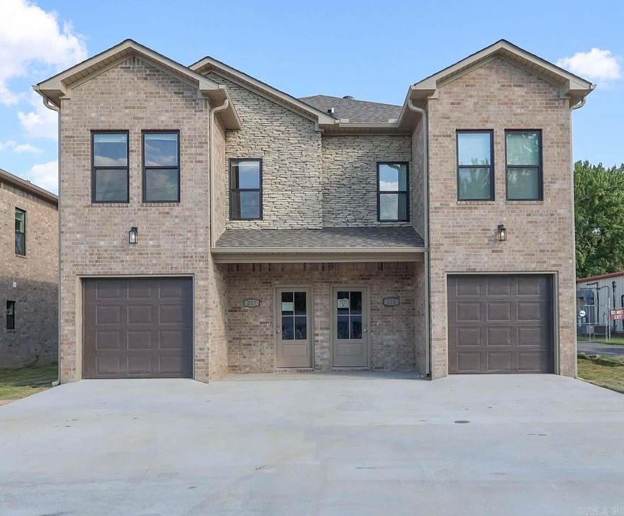 Modern, luxury new construction duplex positioned for exceptional tenant appeal near Little Rock Air Force Base. Located in a highly walkable retail corridor and just 15 minutes from downtown Little Rock, this all-brick property blends premium finishes with everyday convenience.  Each townhome-style unit features a 3-bedroom, 2.5-bath layout with an attached one-car garage. The main level offers open living and dining space with a half bath, while the upper level includes a spacious primary suite, walk-in closet, and private bath. Two additional bedrooms share a Jack-and-Jill bath, with laundry conveniently located upstairs.  Interior highlights include quartz countertops, custom cabinetry, luxury vinyl flooring, energy-efficient windows and doors, blown-in insulation, and new kitchen appliances.  Tenants enjoy walkable access to grocery stores, home improvement retailers, restaurants, and nearby recreation including the Jacksonville Community Center and water park.  Images shown are from a prior build of similar design and finishes. Projected completion/CO in 2026. Sale includes both units.  6 other units available in the same area.  Call for more details.