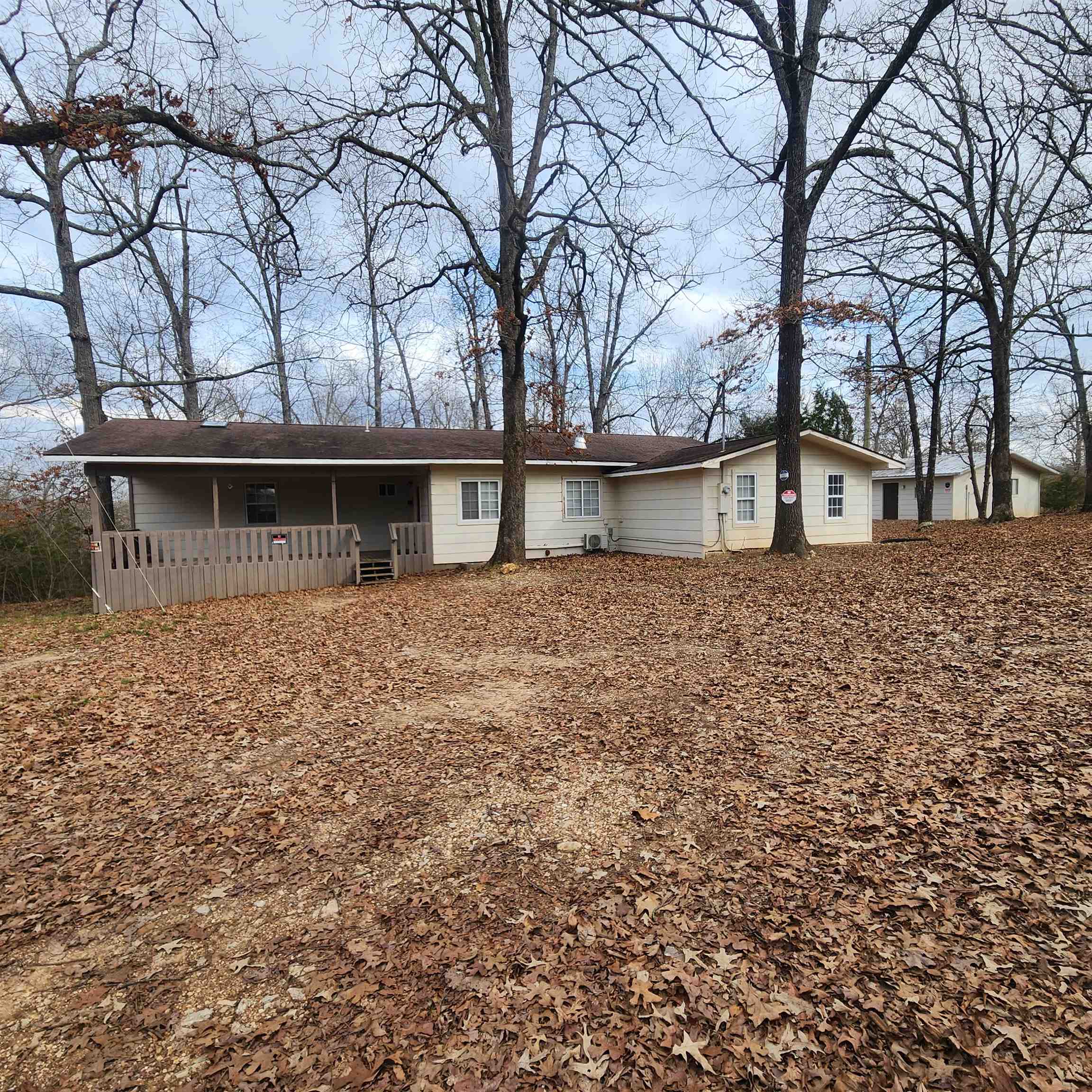 Must see home with 3 or 4 bedrooms and 2 baths, make up this updated home with a 2-car detached garage/shop in Highland Arkansas. Lots of updates including a huge Master Bedroom and Bath with a walk-in closet located at one end of the home. Separated by the kitchen, living room, dining area laundry room and the 2nd bathroom are 2 or 3 more bedrooms. depending on how you want to use the middle room. It could be used as a nursery or office as well. The 2-car detached garage has a large office on it as well it could be a guest room for overflow guests or as an office if someone wanted to use the garage as a workshop. Schedule you're showing and see this wonderful property as soon as you can.