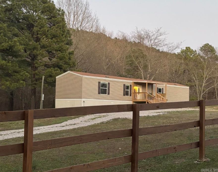 Like new 3-bedroom 2 bath home, conveniently located on 1.21 acres. New 10 x 20 deck on back & 10 x 14 covered deck on front. All new stainless-steel appliances. Home is on a permanent foundation & has vinyl siding, shingle roof & vinyl windows. This is a beautiful acreage that is a very rare find! Enjoy country living with all city amenities. 1 1/2 miles to Dollar General & 3 miles to Mcdonalds, Harps grocery store, etc. NO OWNER FINANCING OR RENT TO OWN. I can put you in touch with a wonderful lender.