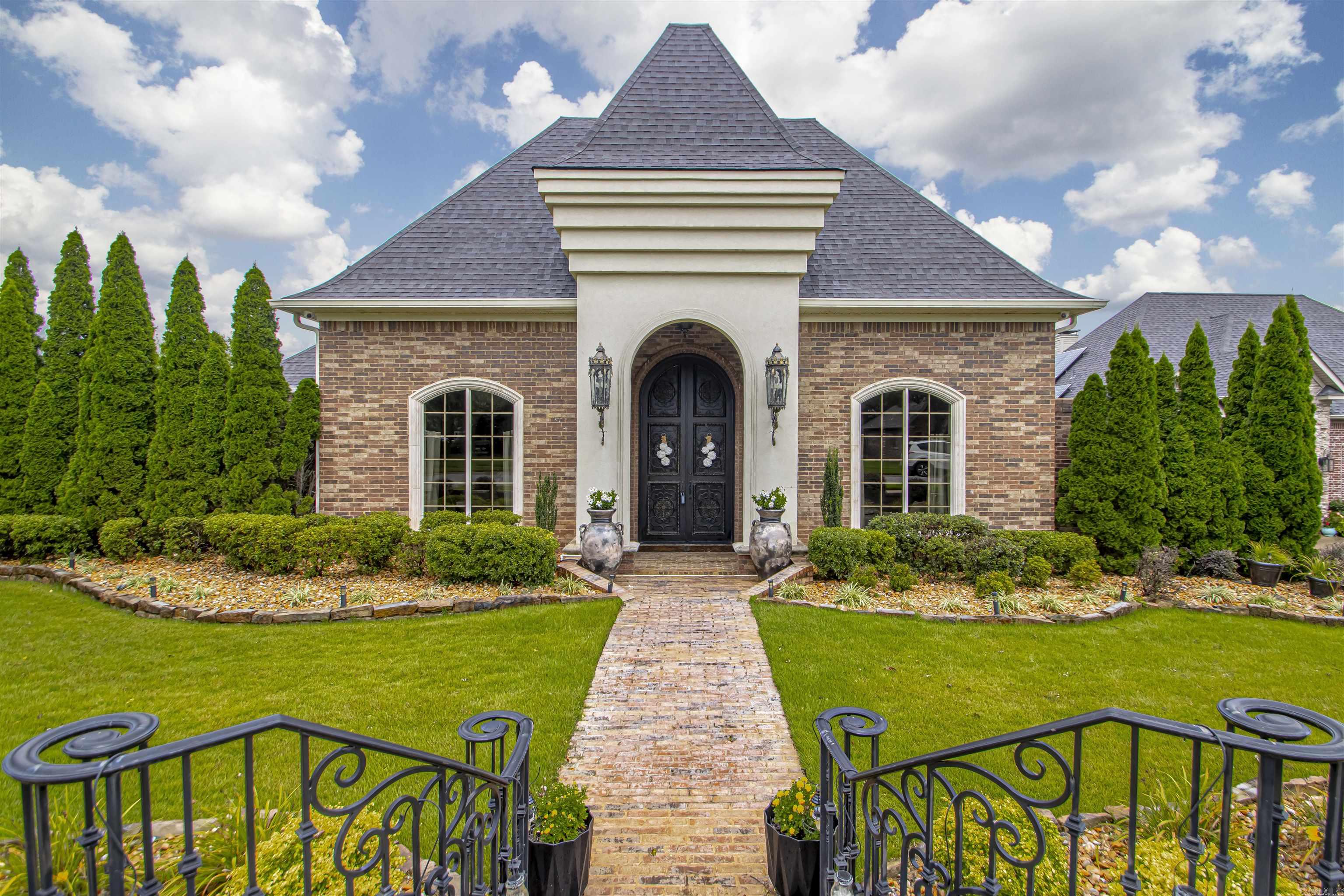 Gorgeous Home in West Pointe subdivision. Stunning corner lot with lots of landscaping, 4 bed rooms and 3.5 baths, brick and stucco house in the heart of North Bryant. Gourmet kitchen, Wet bar, theatre room, in-law quarters/secondary master. Talk about a master bedroom/bath combination. You must see to believe, you won't want to leave. Updates! - LED low energy lights throughout the house. New paint floor to ceiling including all trim and the floor to ceiling cabinets. A complete custom bathroom and tiled walk-in shower. 2 king and 2 queen floating beds with floating nightstands. Tankless gas water heater. New RPZ valve and updated sprinkler system. What a great Salt water pool. New pool liner and pump (less than year old). Great lay out right off porch. sit relax, party, enjoy with family and friends. Plenty of room for everyone and easy to keep an eye kids. New amplifier, subs and speakers in the theater. New wood fence, New flower Beds with mulch replaced with river rock. New cameras for security system added (2 months old), and new ice maker. This can and should be your new CASTLE in Bryant. You do not want to miss this opportunity. Take a look today!