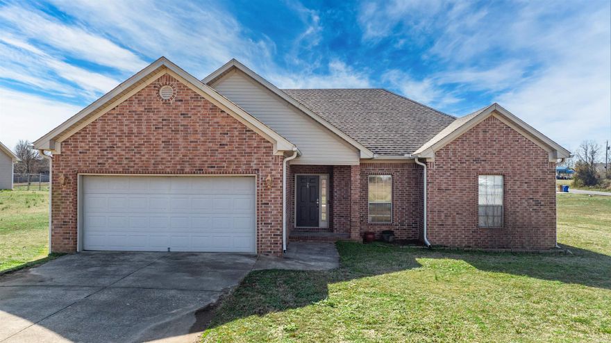 Welcome to this beautiful brick home nestled in a quiet Greenbrier subdivision, offering comfort, space, and a peaceful setting. This one-story, 3-bedroom, 2-bath home features a thoughtful layout to maximize square footage. Inside, you’ll find a cozy living area anchored by a gas-log fireplace, perfect for relaxing evenings. The kitchen and dining combo offers great functionality, while the sizable laundry room adds everyday convenience. The spacious primary suite is completed with a large walk-in closet and an ensuite bathroom featuring a double vanity and jetted tub. New carpet in the bedrooms could be negotiated! Step outside to enjoy the deck overlooking a generous, one-acre corner lot—ideal for kids, pets, or outdoor entertaining. This home combines practicality with charm. Don’t miss the opportunity to enjoy quiet living with plenty of room to spread out.